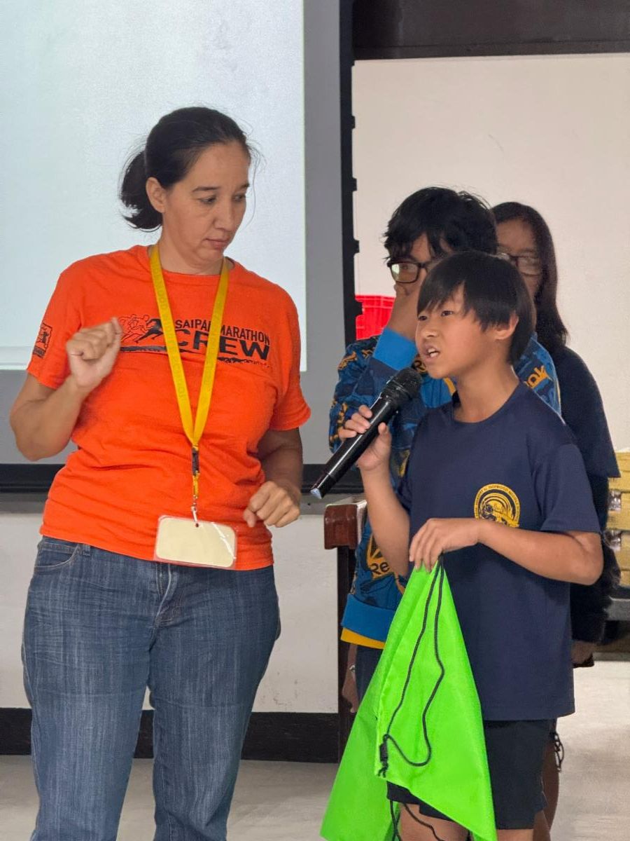 Students of Hopwood Middle School share what they’ve learned about The Marianas tourism industry on Nov. 6, 2024, as Marianas Tourism Education Council Board Member Catherine Perry looks on. MTEC and the Marianas Visitors Authority presented at the school in Chalan Piao, Saipan.