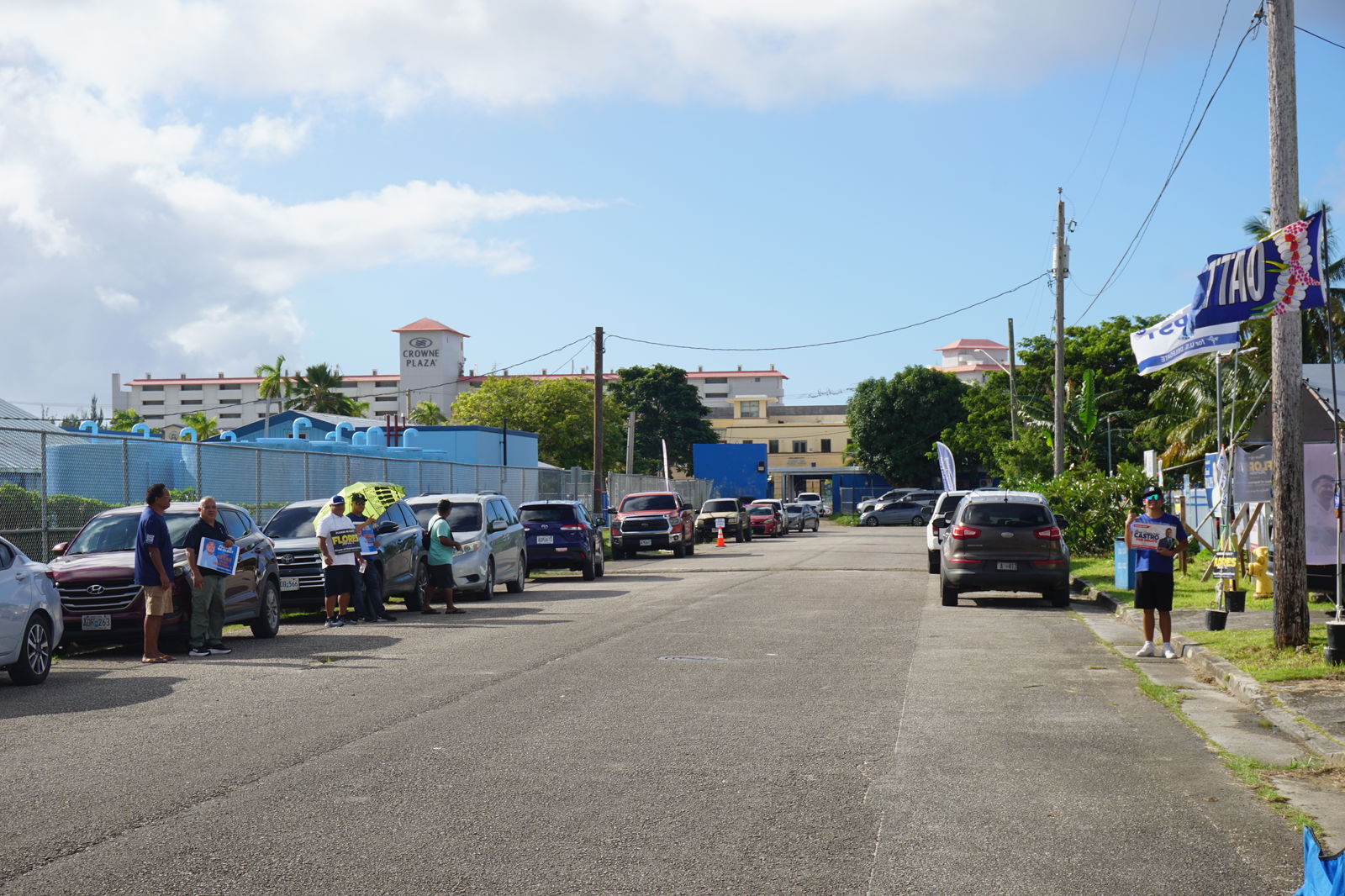 Candidates and their supporters campaign for votes outside Garapan Elementary School on Tuesday, Nov. 5.
