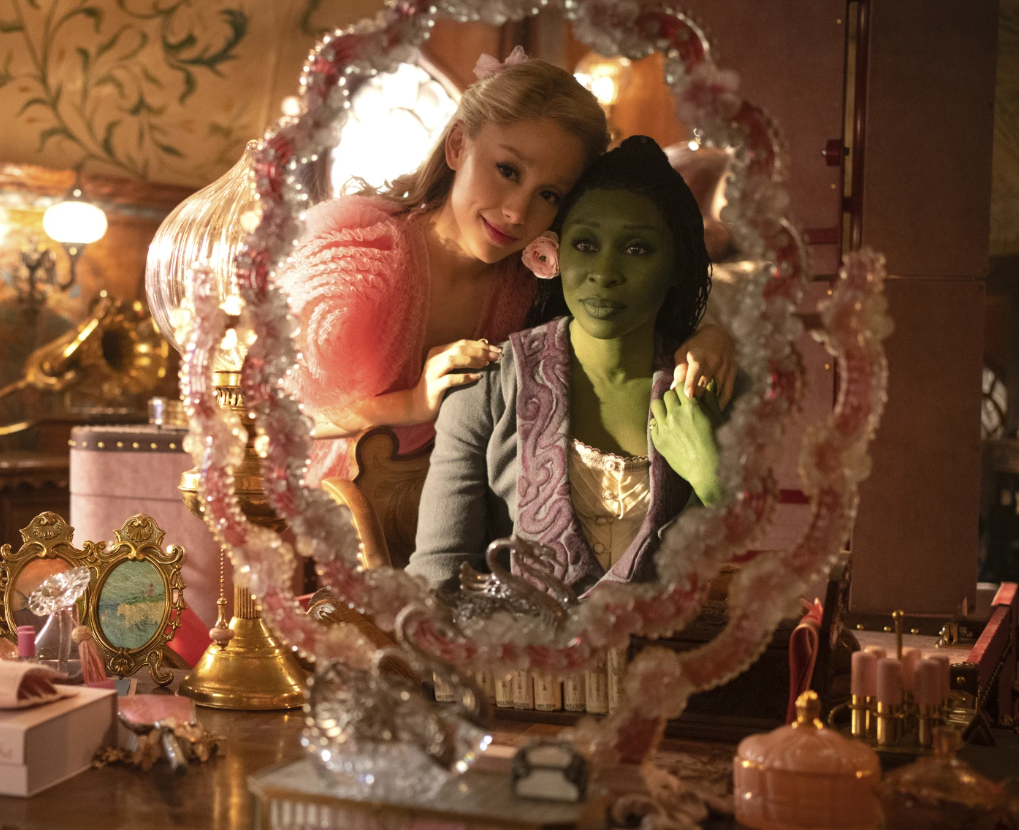 Ariana Grande, as Glinda, left, and Cynthia Erivo, as Elphaba, in a scene from the film “Wicked.”
