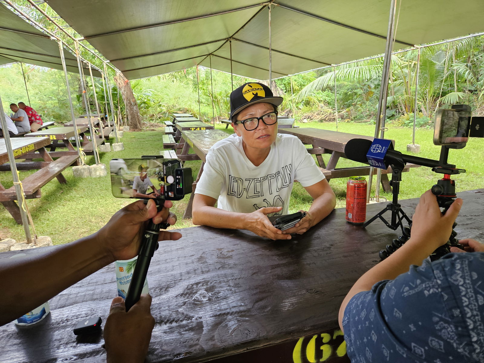 U.S. Delegate-elect Kimberlyn King-Hinds speaks to reporters under a canopy outside her As Gonno house on Wednesday afternoon.