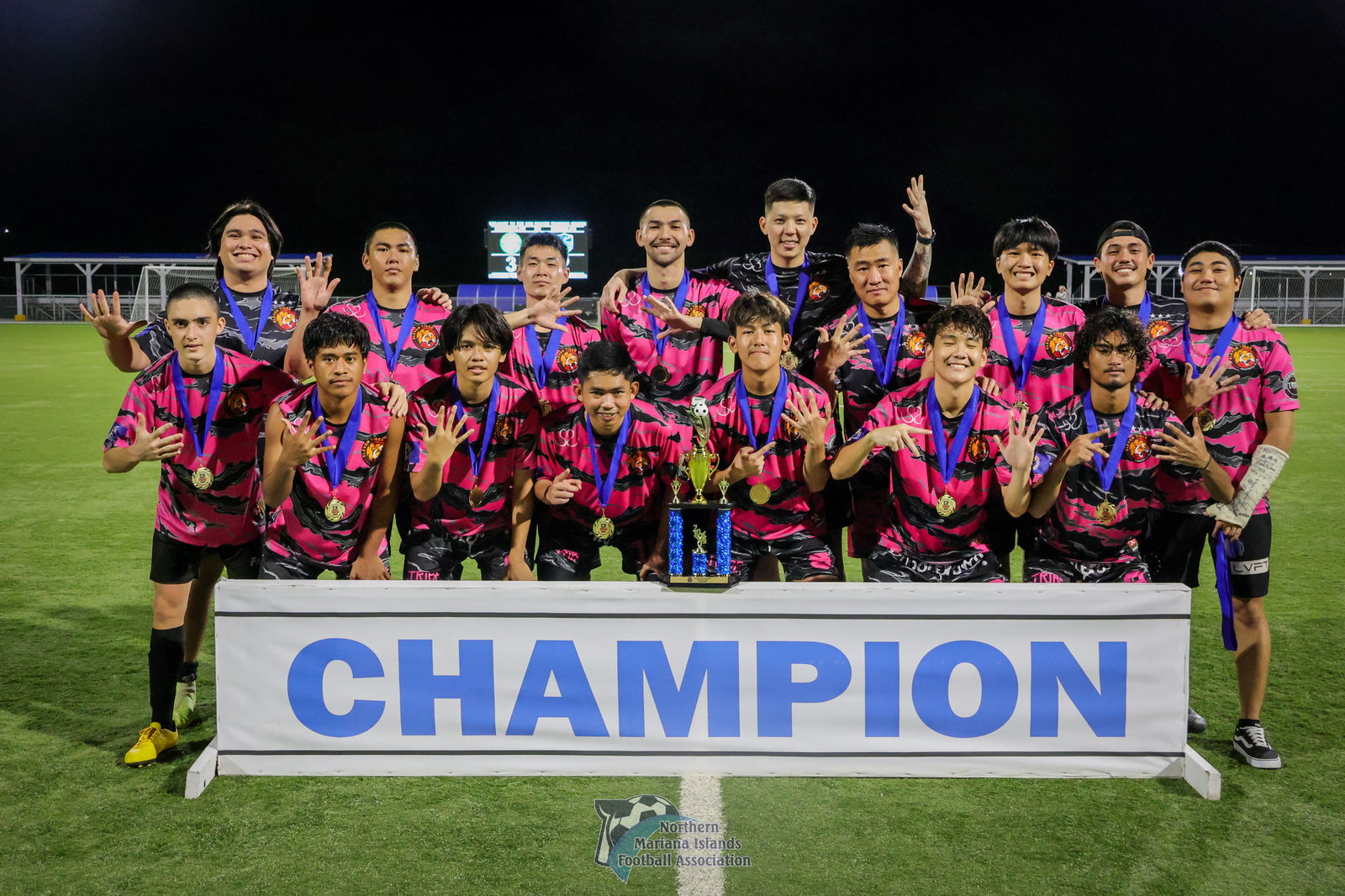 Matansa Football Club players pose for a group photo with the Marianas Soccer League 1 Fall 2024 championship trophy after defeating Kanoa Football Club, 3-2, at the NMI Soccer Training Center on Sunday.