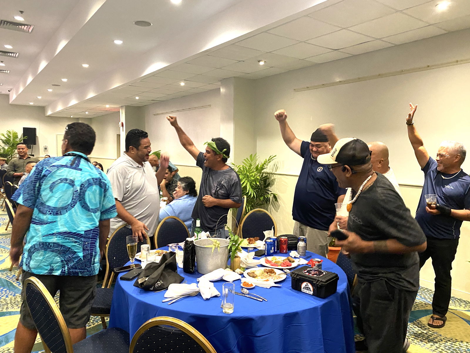 Some attendees cheer as their friend wins a raffle prize.