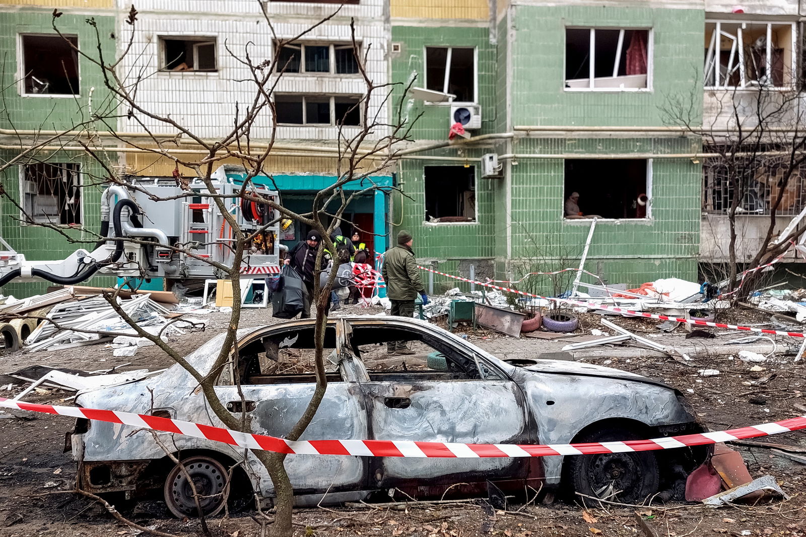 A view shows a destroyed car in front of a residential building, which was damaged by a Russian missile strike in Sumy, Ukraine Nov. 18, 2024.