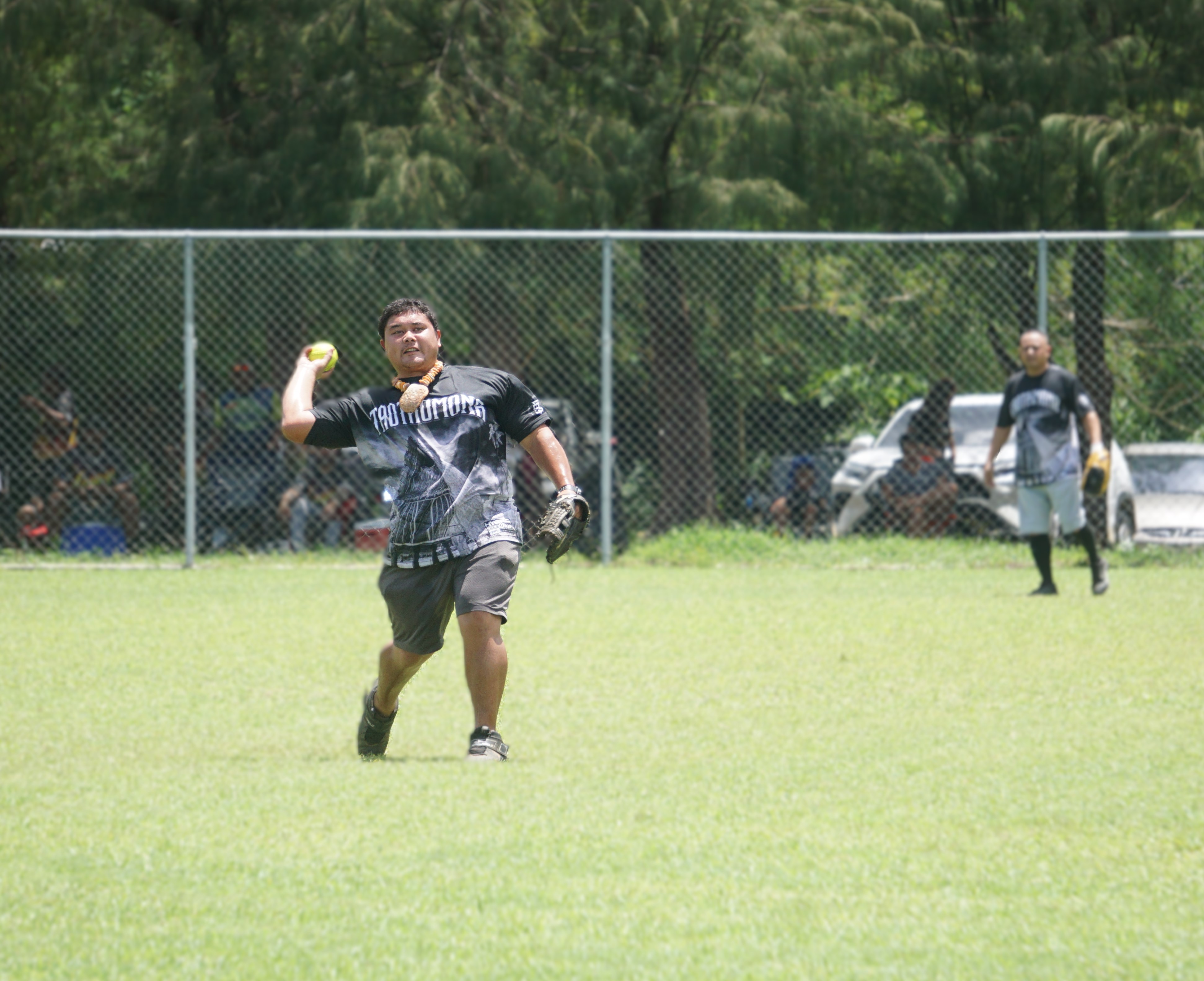 Taotao Mona second baseman Brandon Lieto winds up to pick off a runner on first base during a game of the 2024 Budweiser BASA Open League at the Dandan softball field. 