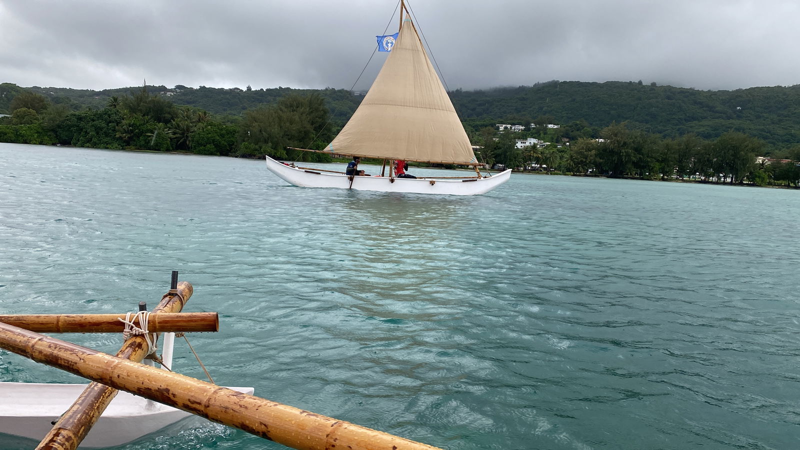 While riding inside Neni, this reporter snaps a photo of Anaguan sailing through the Saipan Lagoon.