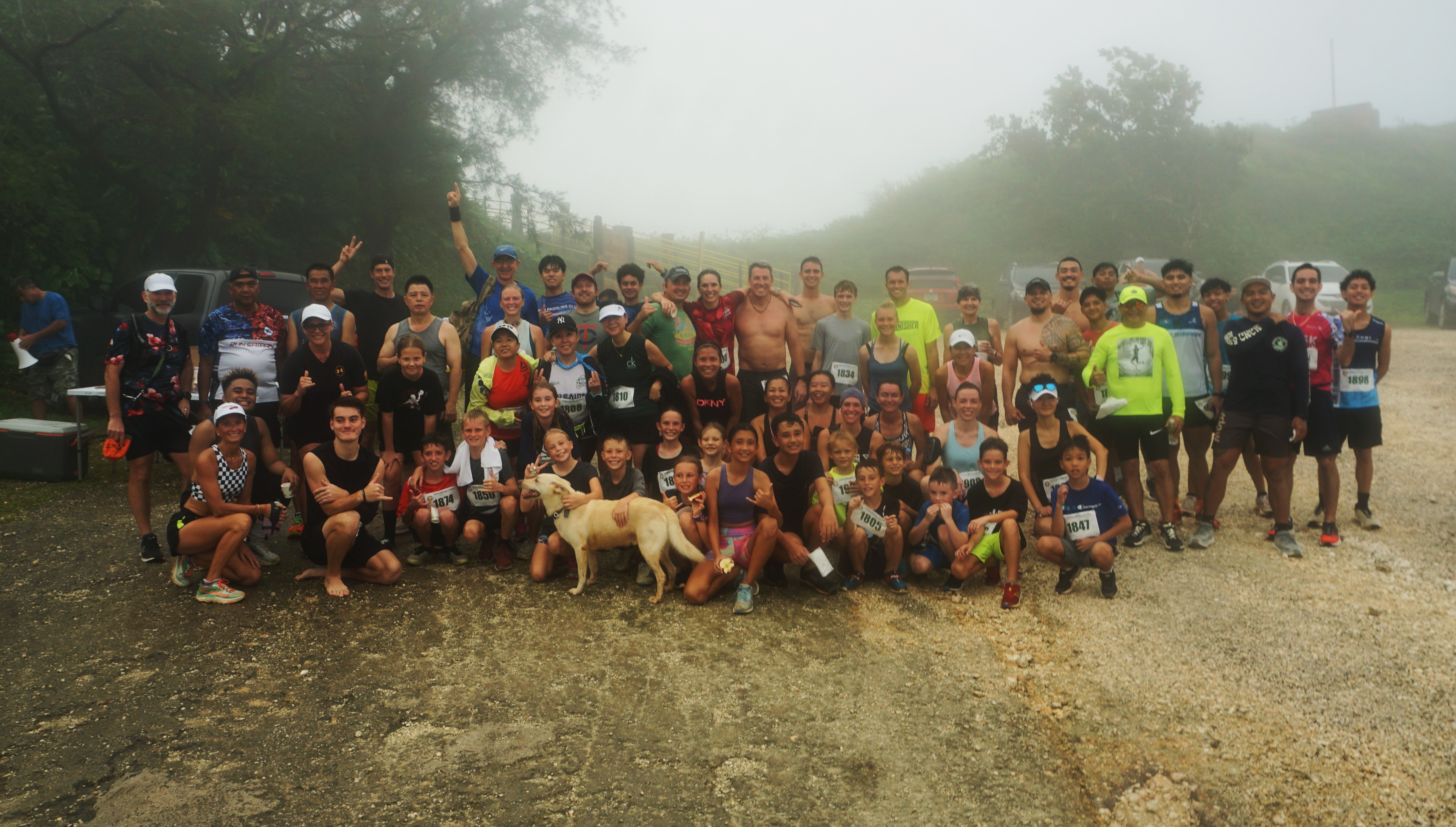 Participants in the Mt. Tapochau Turkey Trot 2024 pose for a group photo early Thursday morning at the mountain’s peak.