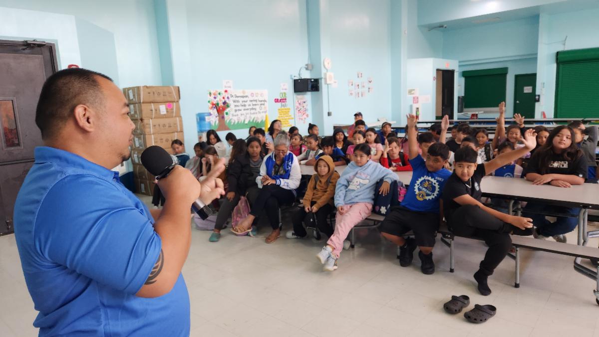 Students at Kagman Elementary School respond as Marianas Visitors Authority Community Projects Coordinator Sherman Santos presented about The Marianas tourism industry on Nov. 20, 2024.