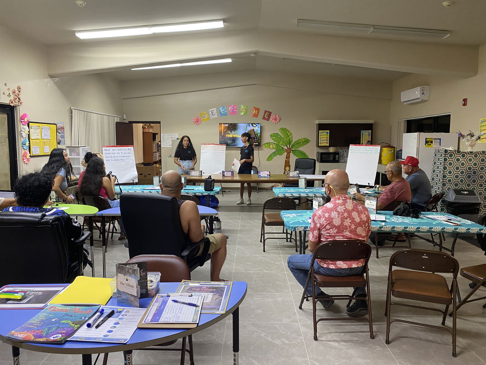 Community members attend a village planning meeting at the Tanapag Youth Center on Friday