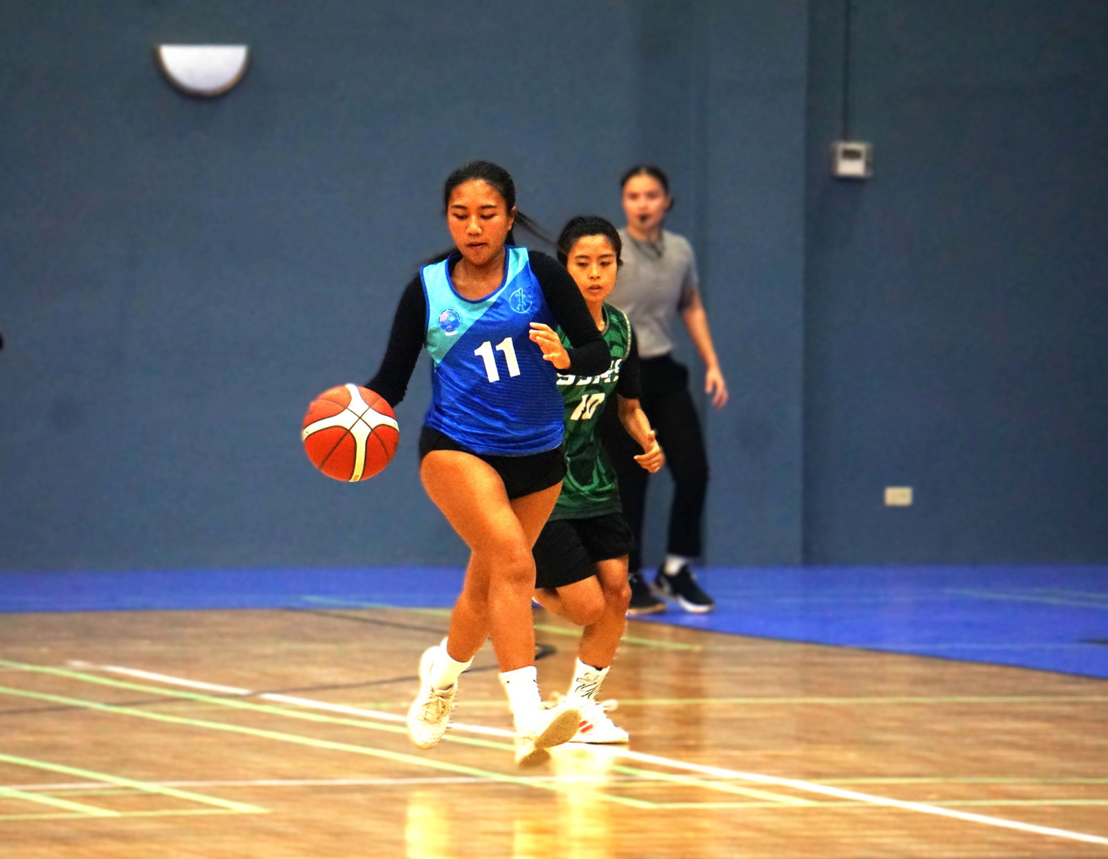 Saipan International School's Euanne Claveria dribbles past a defender during a game against SSHS JV in the girls high school division of the PSS-NMIBF Interscholastic Basketball League SY24-25 at the Ada gym on Friday. 