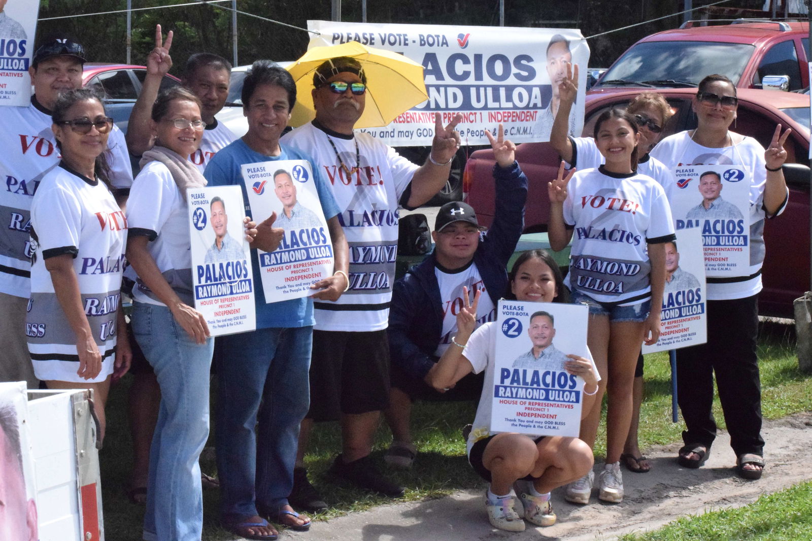 The supporters of Precinct 1 House candidate Raymond Ulloa Palacios pose for a photo on Beach Road in San Antonio.