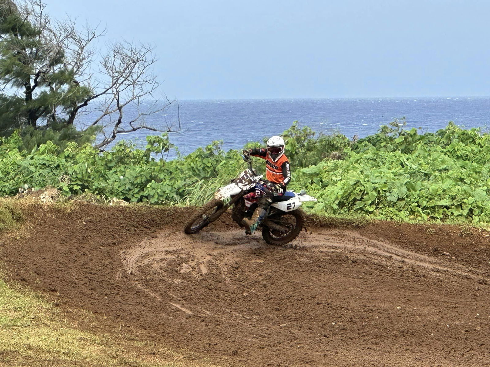 Aric Cruz executes a turn in the muddy tracks of the Cow Town Raceway Park as he leads an Intermediate Class race during the Marianas Racing Association’s 2023 Turkey Cross.