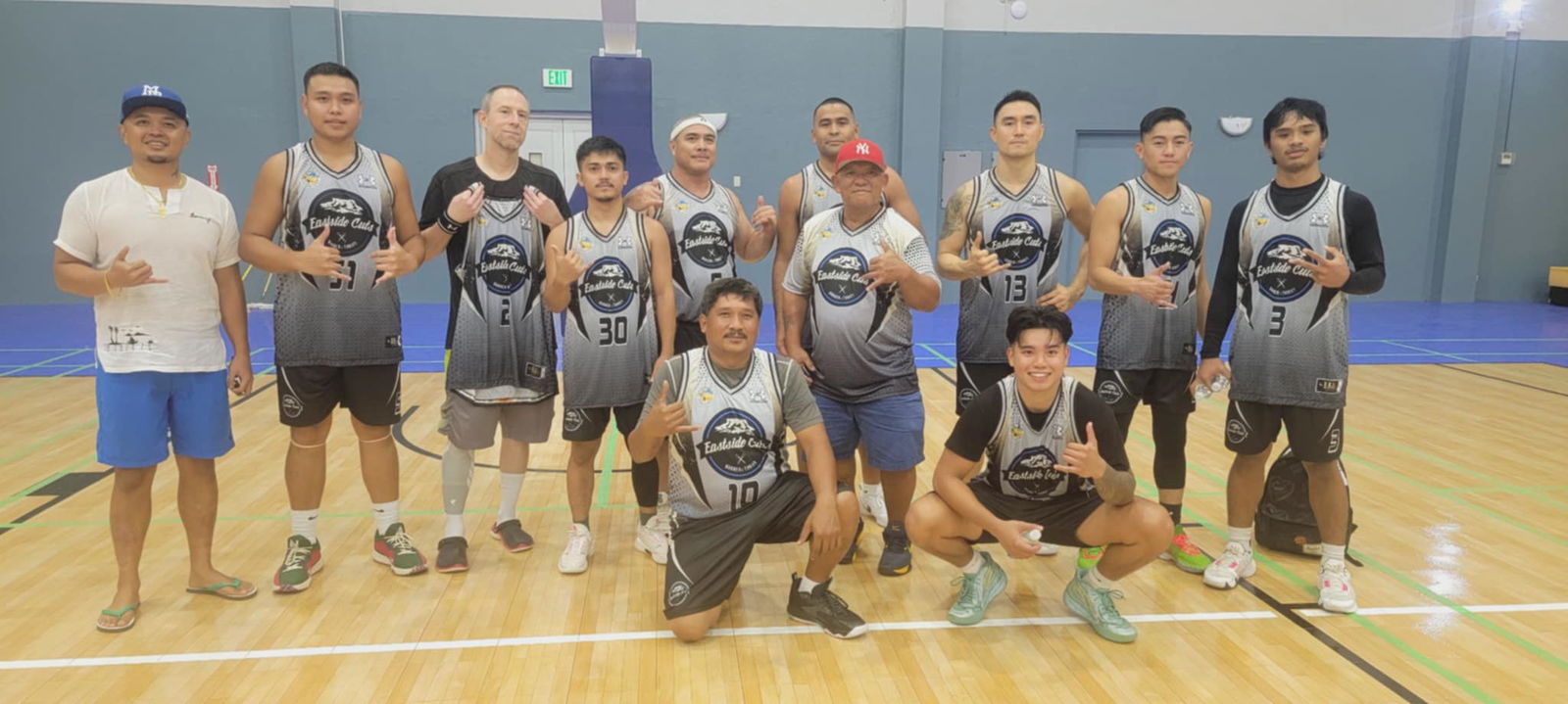 East Side Cuts/Saipan Fresh Market players pose for a group photo after beating Elite in the open division of the 2nd Saipan Magalahi Eagles Club – Saipan MagaHaga Lady Eagles Group Basketball Tournament 2024 at the Ada gym on Saturday.