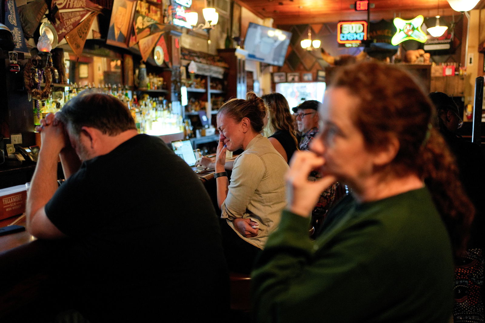 Donilee McGinnis, 42, regional organizing director for North Fulton for the Harris-Walz campaign, reacts while watching Democratic presidential nominee Kamala Harris give a speech at Howard University in Washington, conceding the 2024 presidential election to President-elect Donald Trump, at Manuel's Tavern in Atlanta, Georgia, Nov. 6, 2024.
