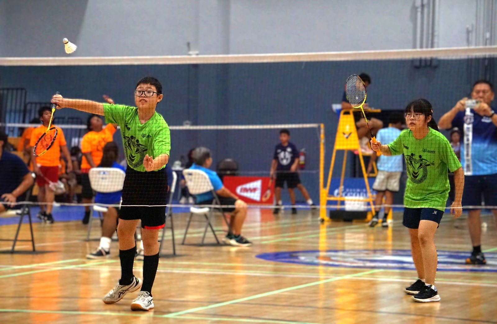 Agape Christian School 2 players serve against their opponents during a mixed doubles game in the co-ed middle school division of the PSS-NMBA Interscholastic Badminton League SY24-25 at the Ada gym on Saturday.