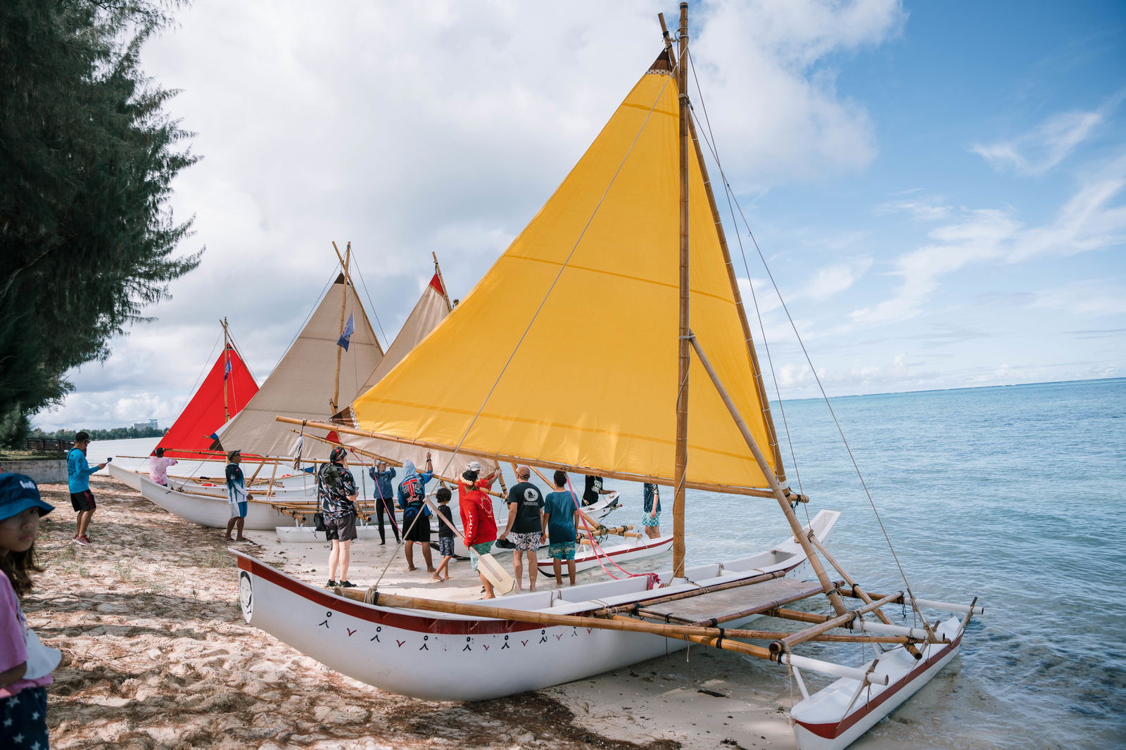 The 26-foot-long canoe Aunty Oba, in the foreground, is named after the late Jacoba Seman, who lived near the shoreline in Susupe, just north of the Guma Sakman. Ms. Seman was also known as “Oba.” When she passed, her family requested the new canoe be named in her honor.