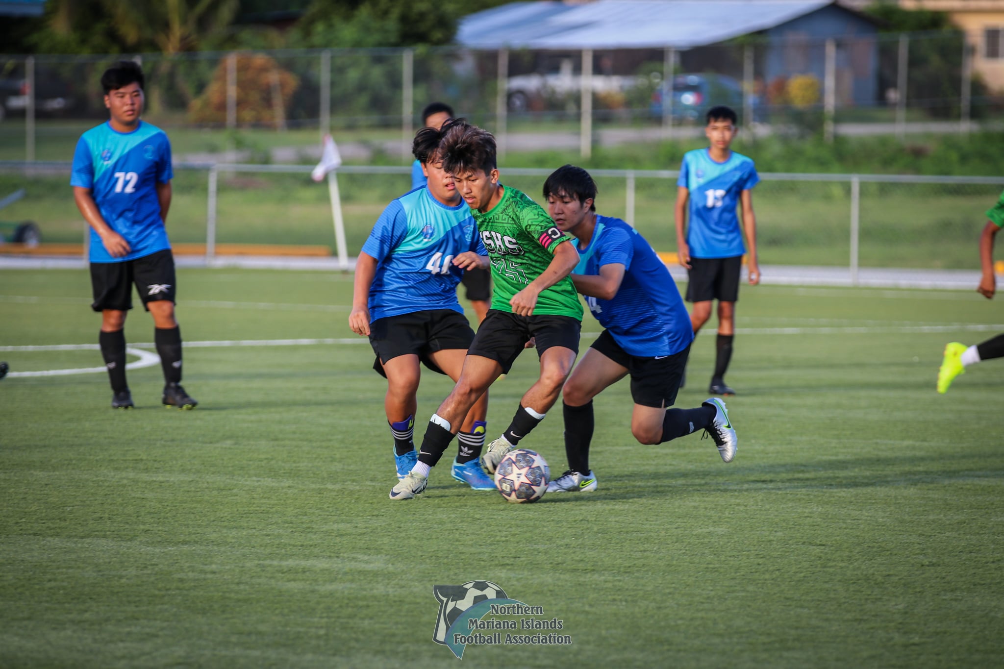 SSHS’ Monico Claridades fights off two defenders to maintain the possession during a match against SIS V in the boys high school division of the PSS-NMIFA Interscholastic Soccer League SY24-25 at the NMI Soccer Training Center on Monday. 