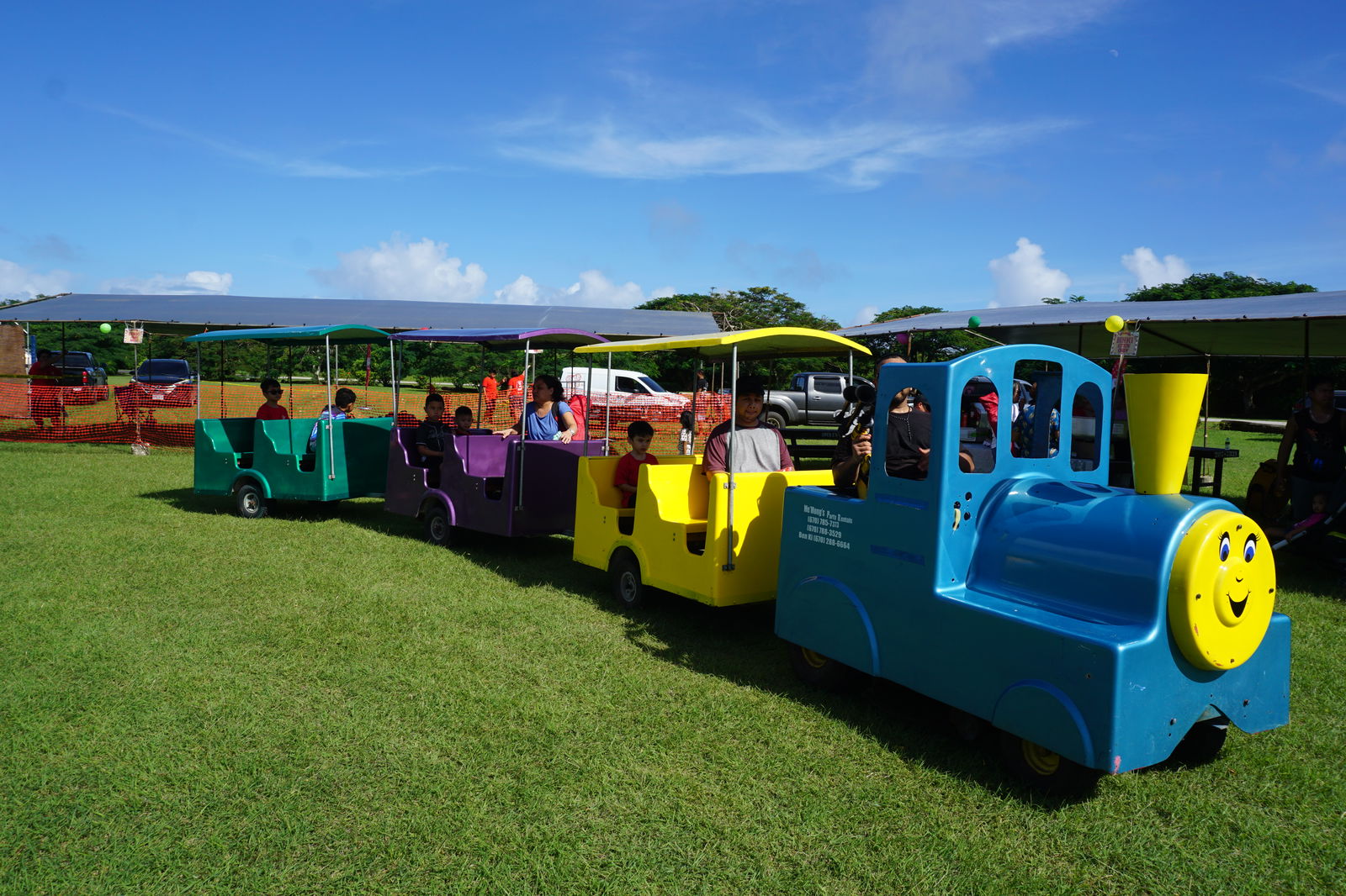 A trackless train operated by Me’Mong’s Party Rentals takes children and their chaperones around Airport Field.