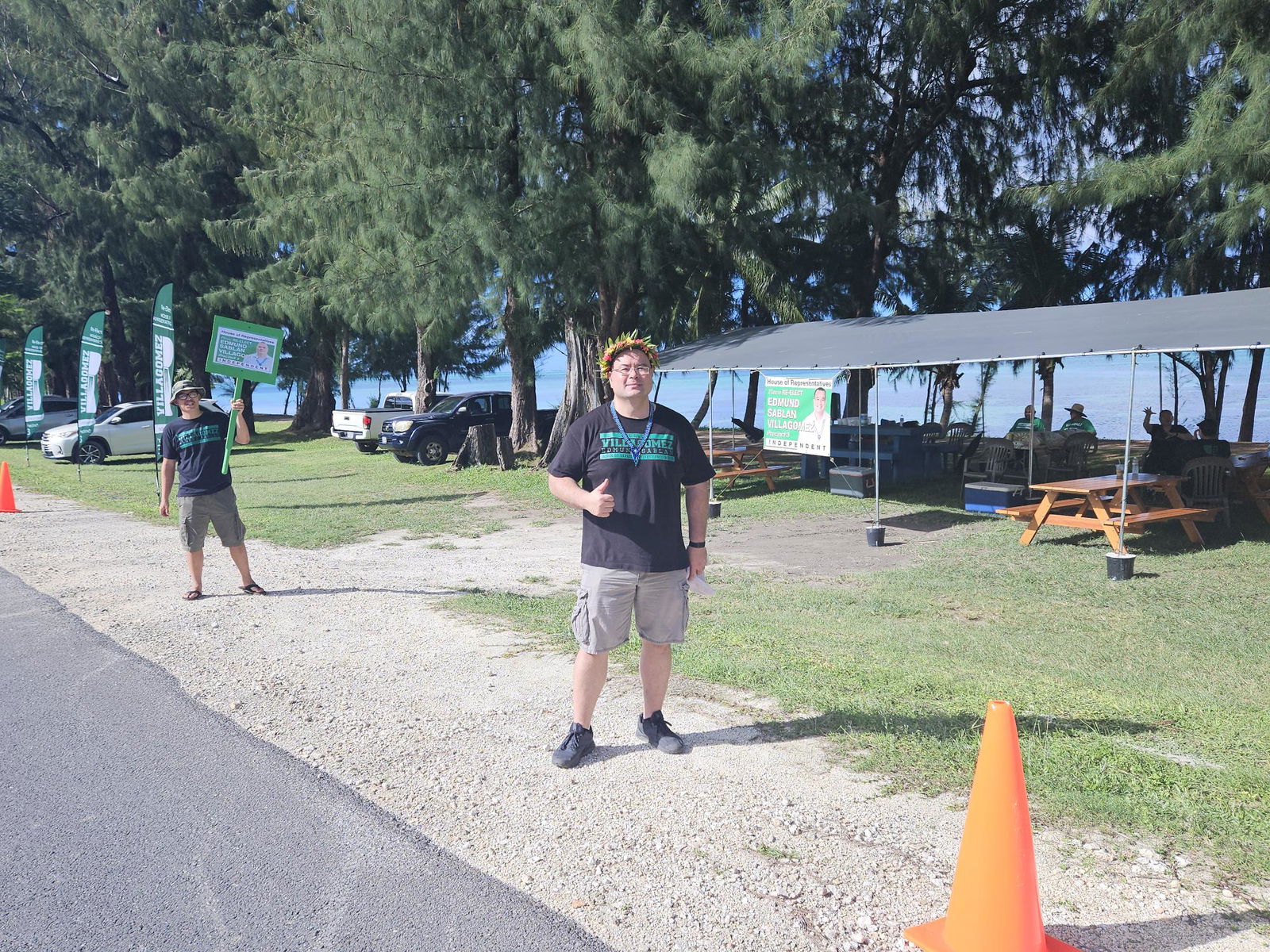 Speaker Edmund Villagomez of Precinct 3 gives a thumbs up on Tuesday morning on Beach Road in Garapan.