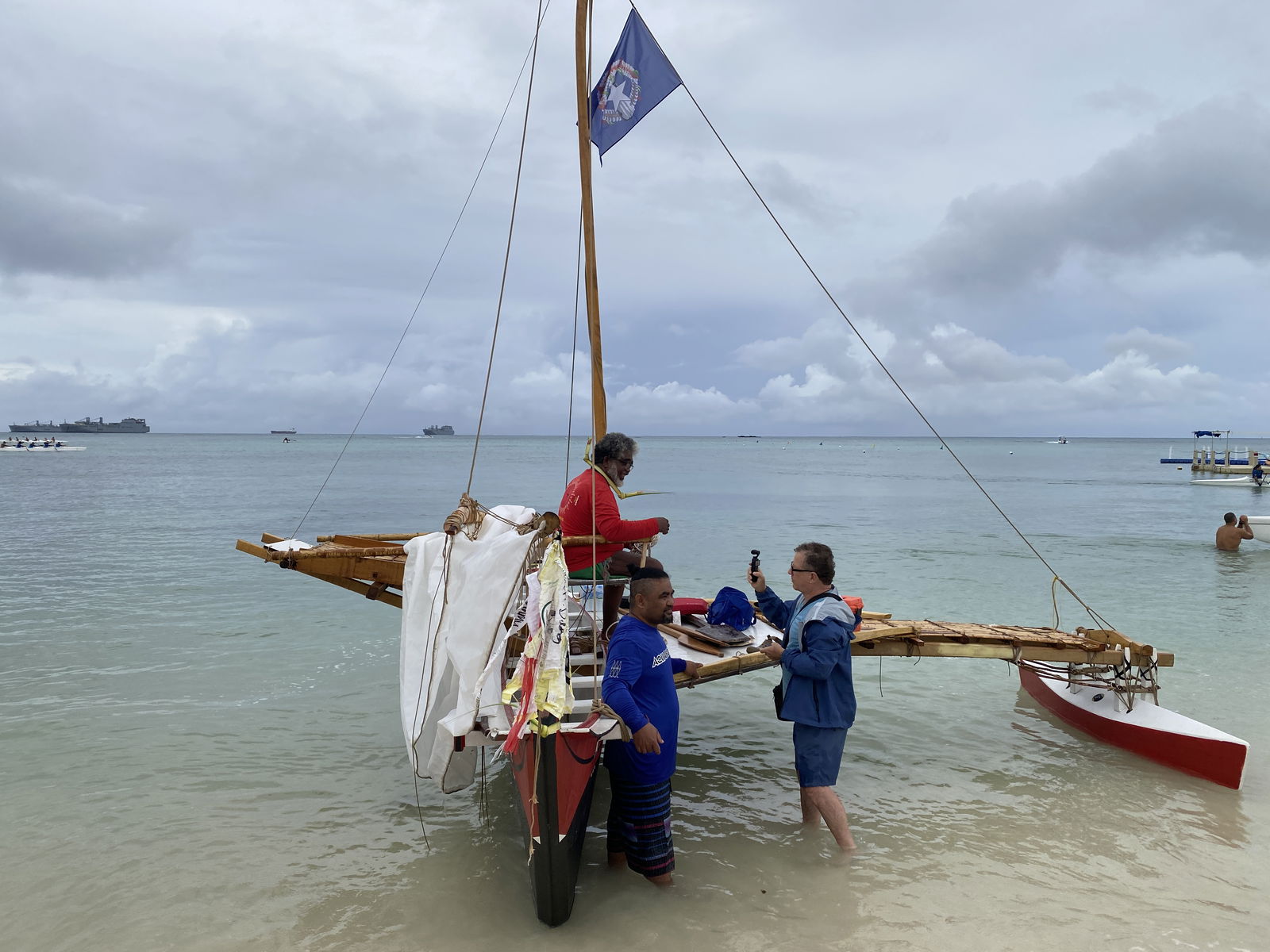 Mario Benito sits atop Mikaela, the fiberglass Carolinian canoe he designed and built. 