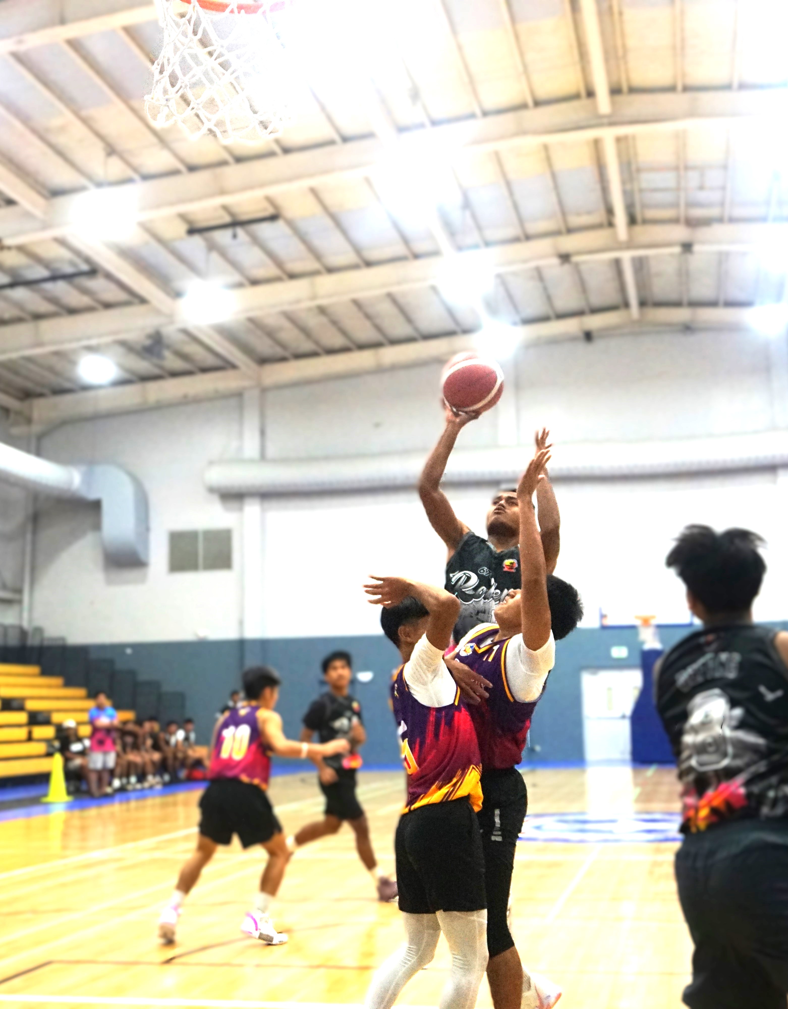 670 Rollers 2's Slymark Defang gets fouled as he goes up for the shot during a game against Barbie Salon/5P's Colecciones in the 2nd Saipan Magalahi Eagles Club – Saipan MagaHaga Lady Eagles Group Basketball Tournament at the Ada gym on Sunday.