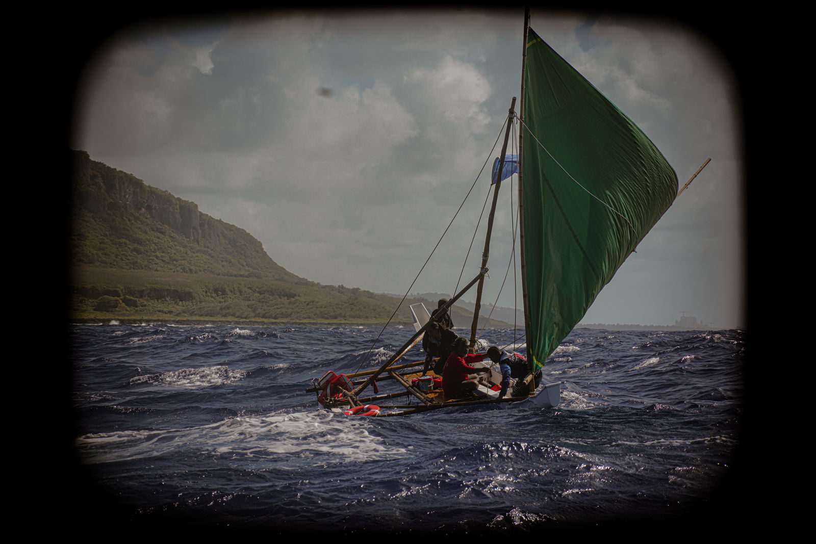 Mario Benito captains Neni as her crew executes a lailai, or shunts her sails, off the coast of Banzai Cliff in Marpi during the Saipan Circumnavigation Sail.  
