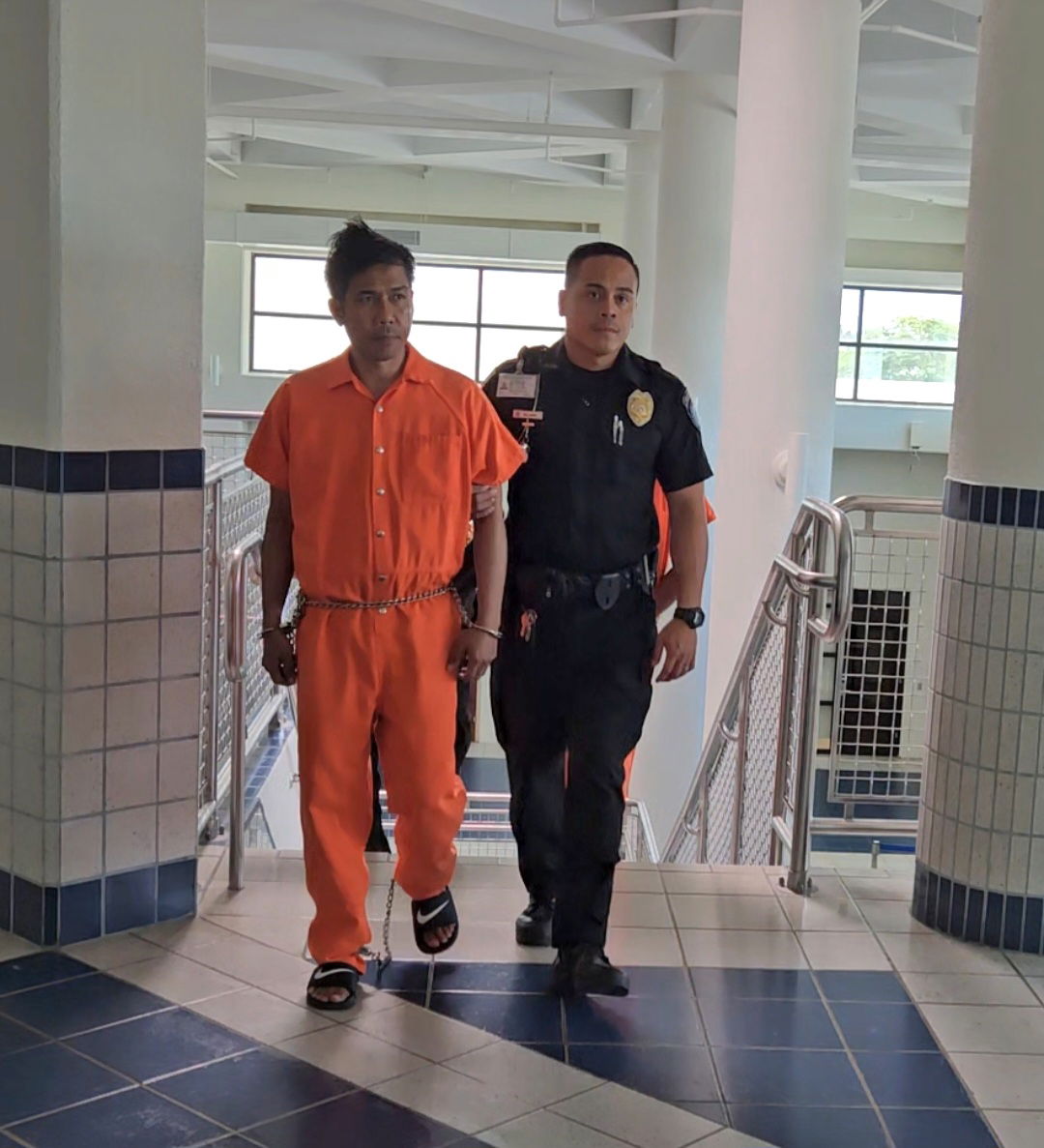 Nick Cena Patulot, 54, is escorted by a Corrections officer at the local courthouse on Monday.