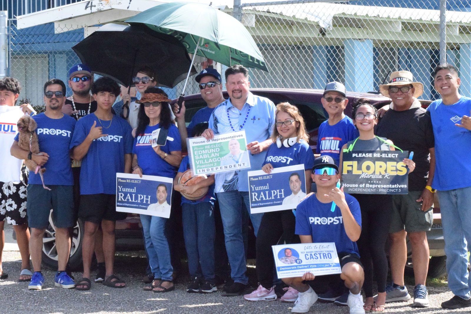 Saipan Mayor Ramon Blas "RB" Camacho, second right, poses for a photo with U.S. delegate candidate Edwin Propst, Precinct 3 Rep. Ralph N. Yumul and their family members outside Garapan Elementary School.