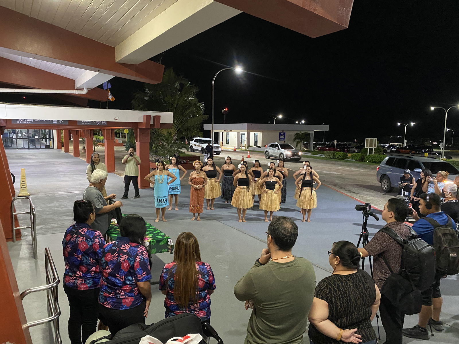 Community members gather at the Francisco C. Ada/Saipan International Airport to witness the return of ancestral remains found on Saipan and Tinian in 1981.