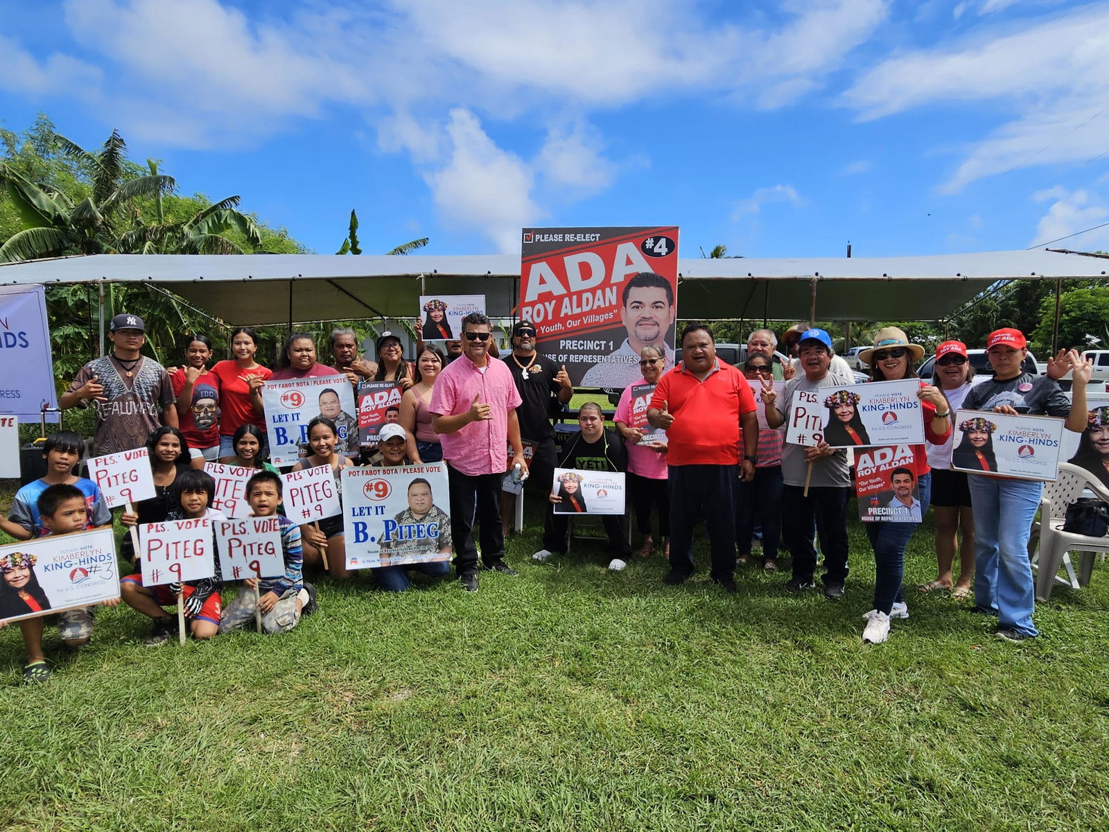 Precinct 1 House Republican candidates Roy Ada and Benusto Piteg pose with their supporters in Dandan.
