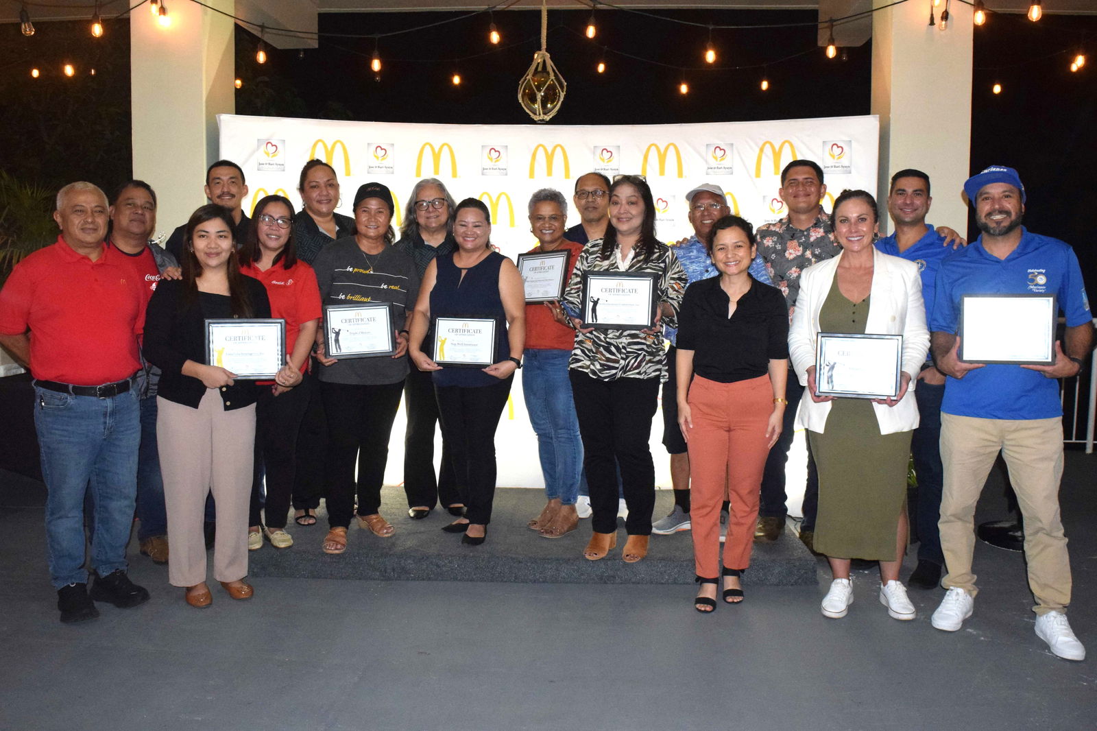 McDonald’s Saipan and Guam President Jose Ayuyu, 6th right, and owner/operator Marcia Ayuyu, 7th left, pose for a photo with some of the sponsors of the 3rd Biennial McDonald's of Guam and Saipan Golf Classic during an “appreciation night” at the Ayuyu residence in San Vicente on Tuesday.