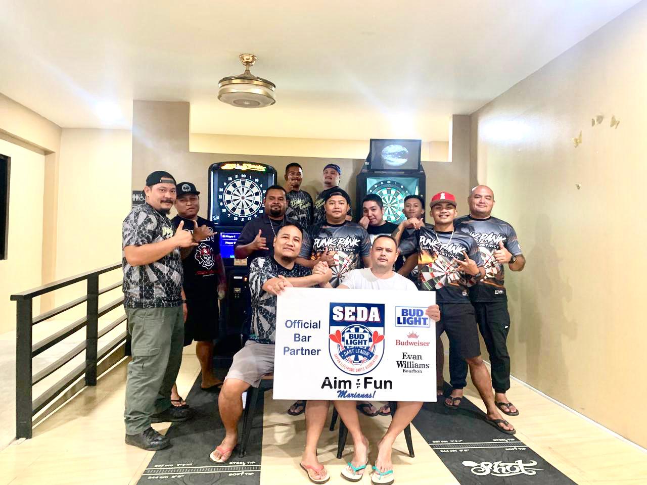 Tambayan Punk Pank and Marvz Darty Gentz dart players pose for a group photo following their game in the Kingfisher C division of the 2024 SEDA Bud Light Dart League at Marvz's Kitchen on Friday.