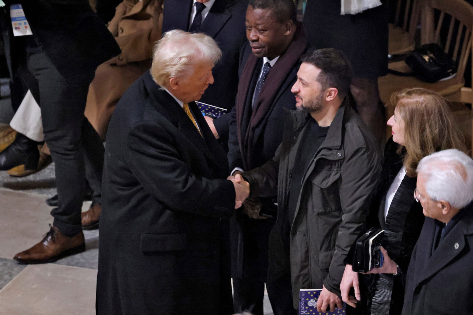 President-elect Donald Trump and Ukrainian President Volodymyr Zelenskiy shake hands inside the Notre-Dame de Paris Cathedral ahead of a ceremony to mark its re-opening in Paris, France, Dec. 7, 2024.