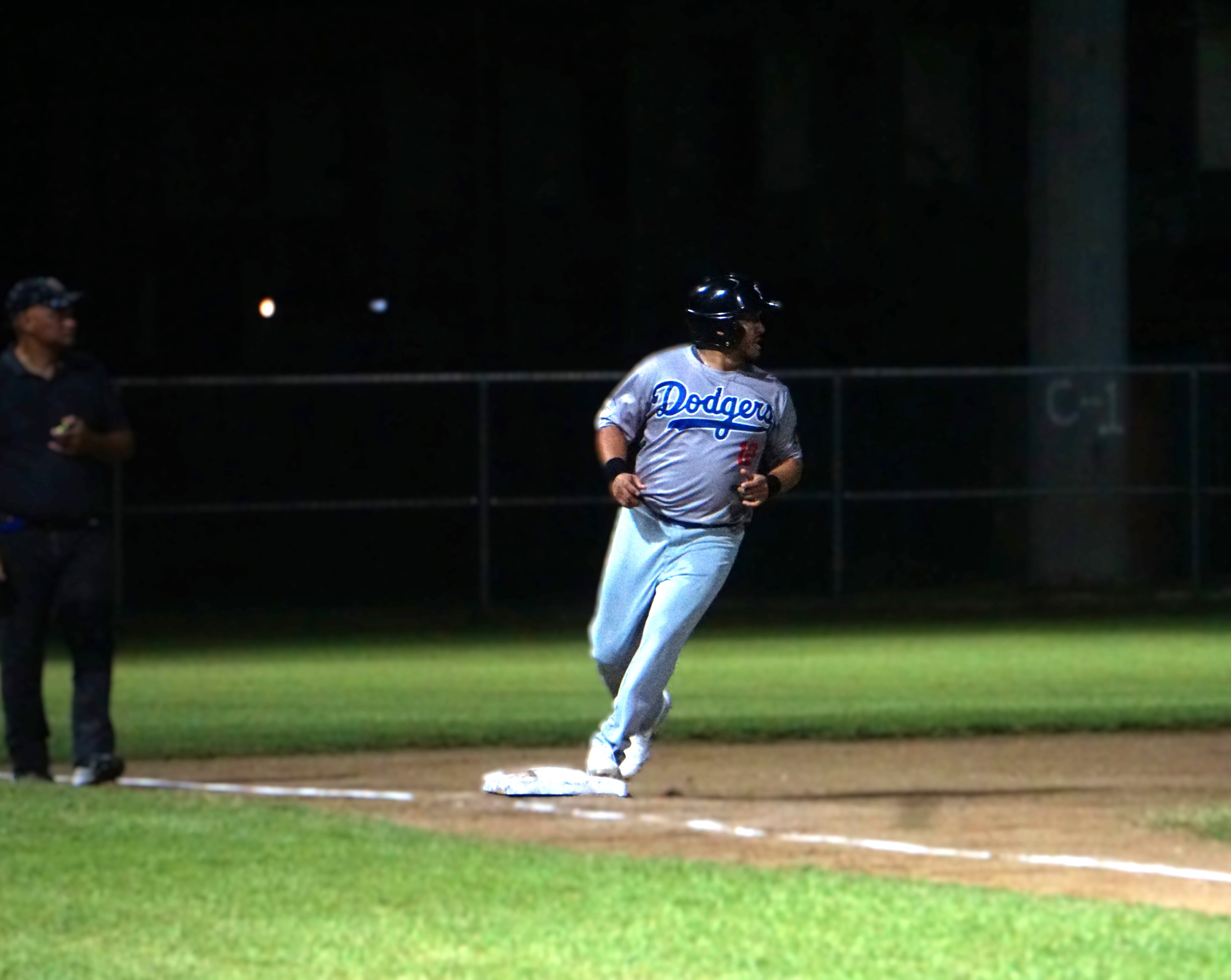The Dodgers’ James Benavente reaches third base safely to open up a scoring opportunity during a game of the 2024 SBL Master's League at the Francisco "Tan Ko" Palacios baseball field. 