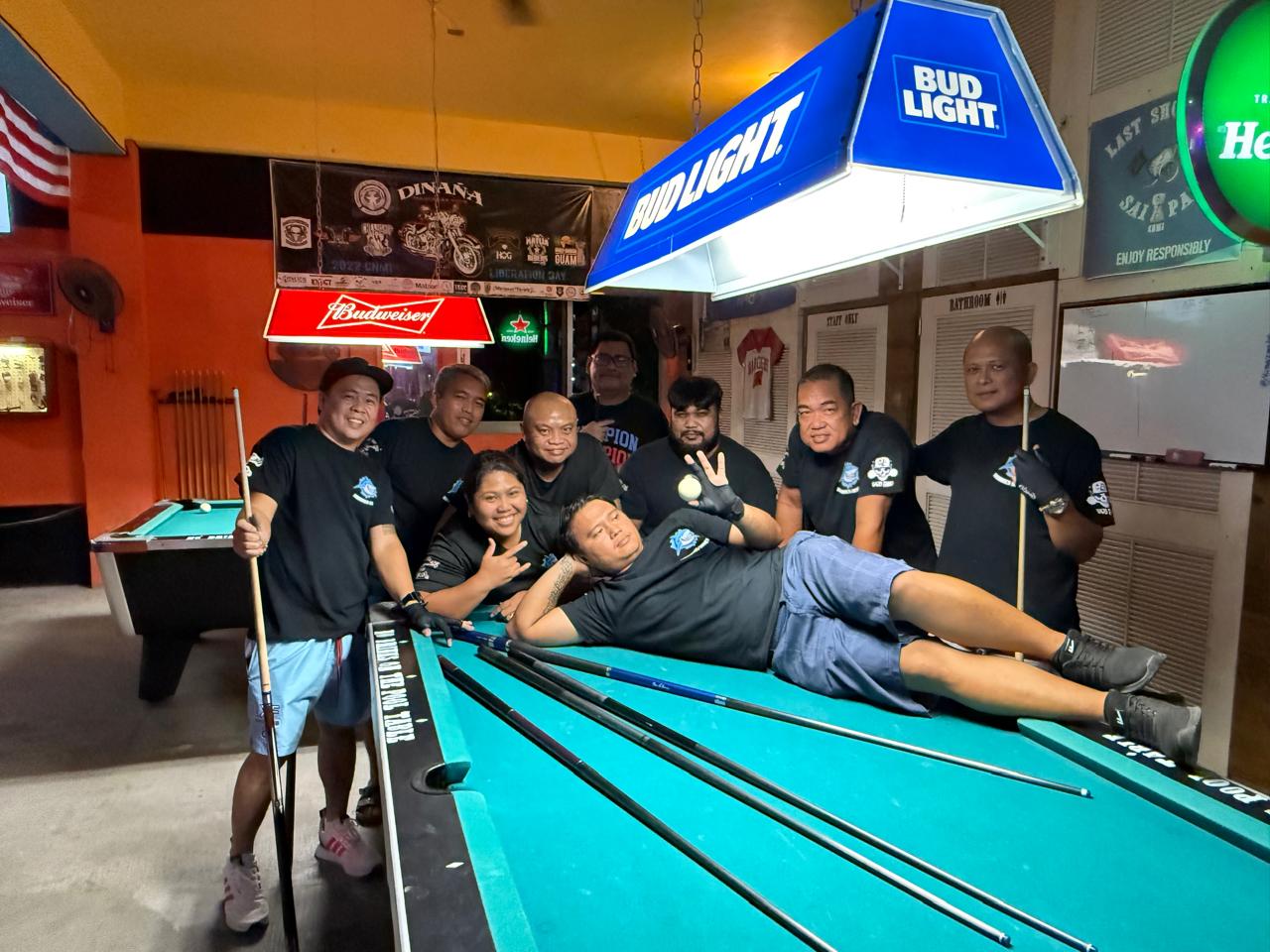 The Last Shot Hobbies Sharks pose for a group photo after securing the Tuesday division title of the 2024 SBA Budweiser Open 8-Ball League at the Last Shot Bar on Tuesday.