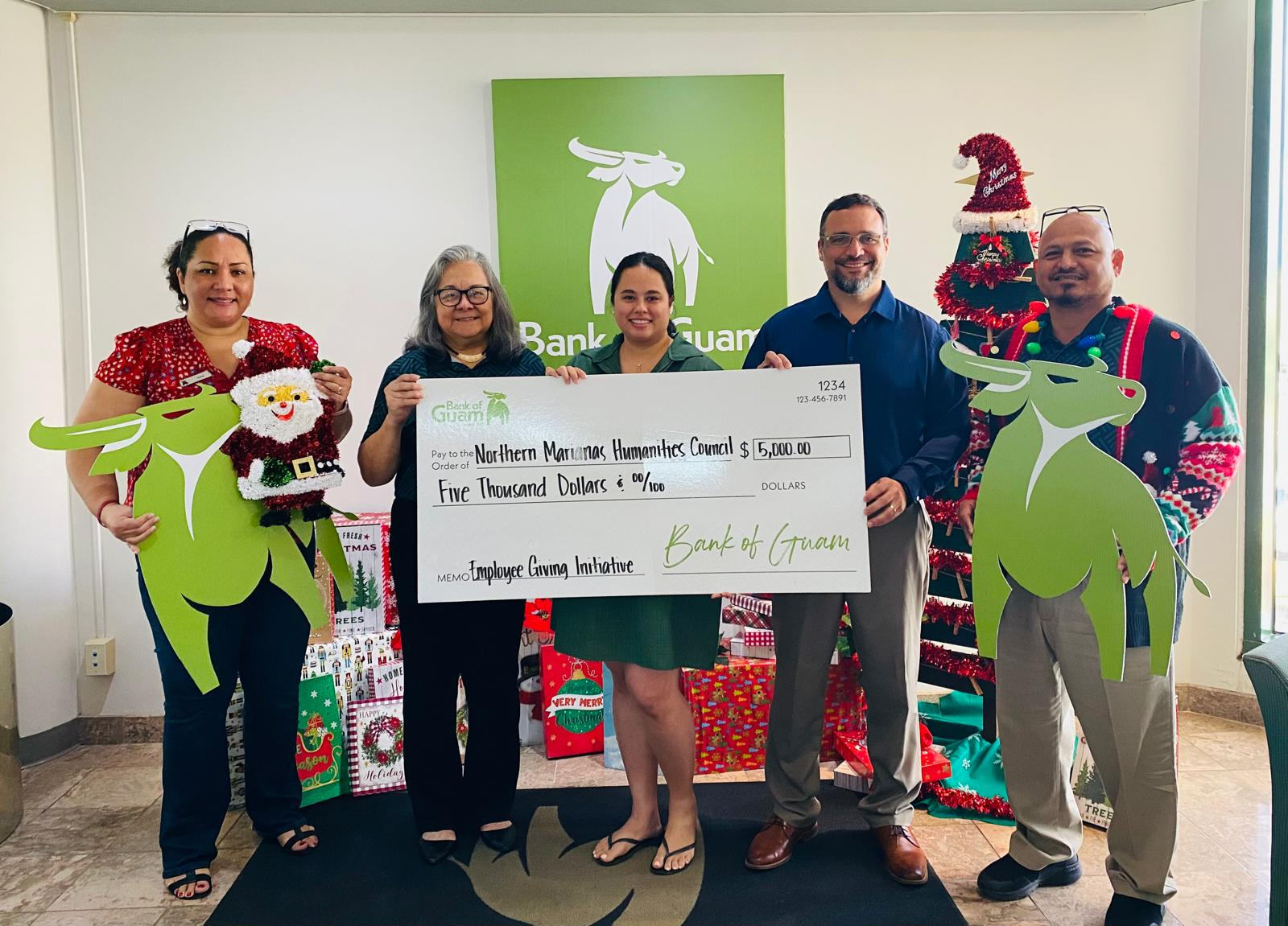 From left, Tania David, Vice President, Garapan Branch Manager, Bank of Guam; Marcie M. Tomokane, Vice President, CNMI Regional Manager, Bank of Guam; Gretchen A. Smith, Chair, Northern Marianas Humanities Council; Leo G. Pangelinan, Executive Director, Northern Marianas Humanities Council; and Augustin Jr. Palacios, Utility Officer IV, Bank of Guam
