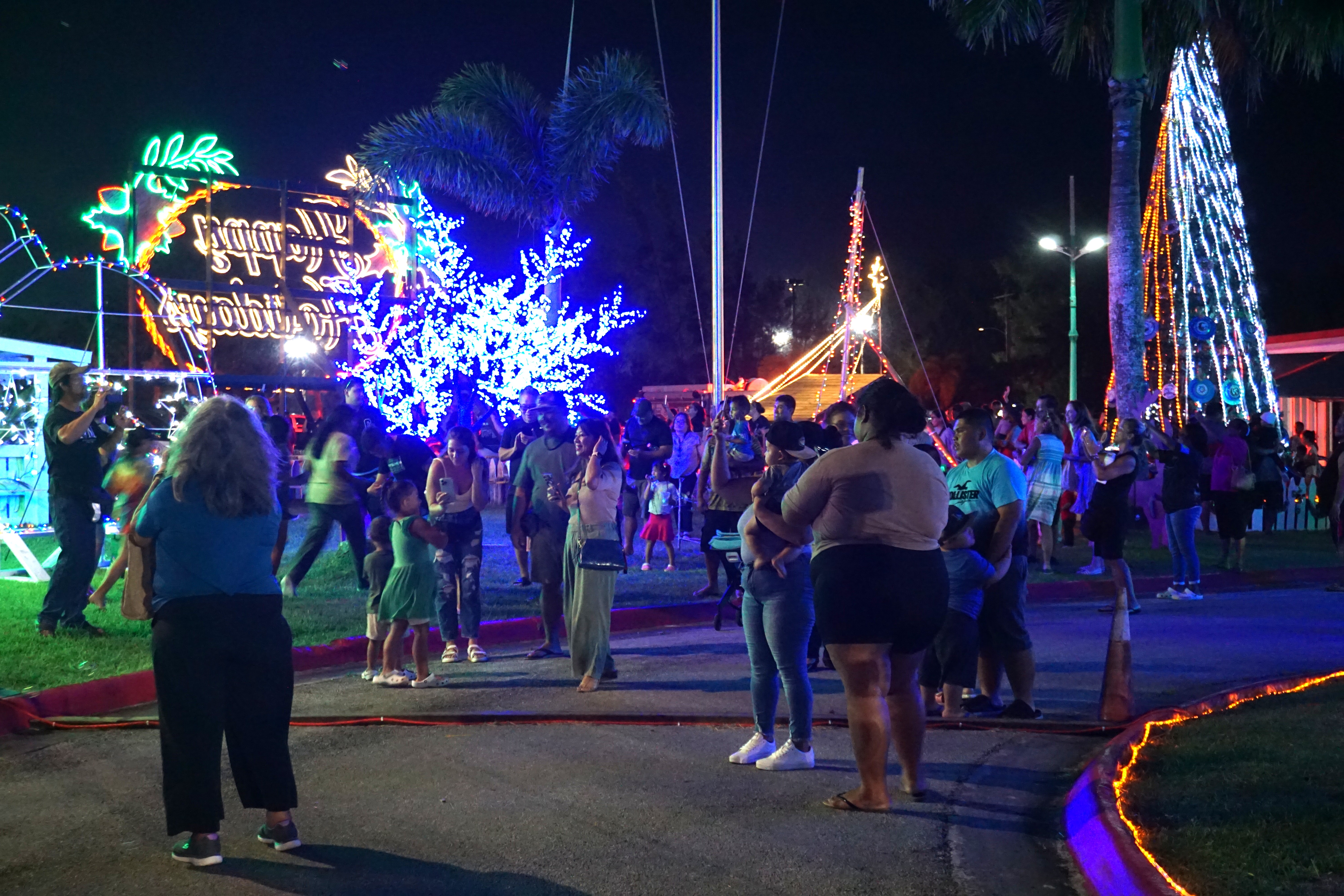 Dozens of island residents were on the grounds of the administration building for the official lighting of the Christmas village on Capital Hill.