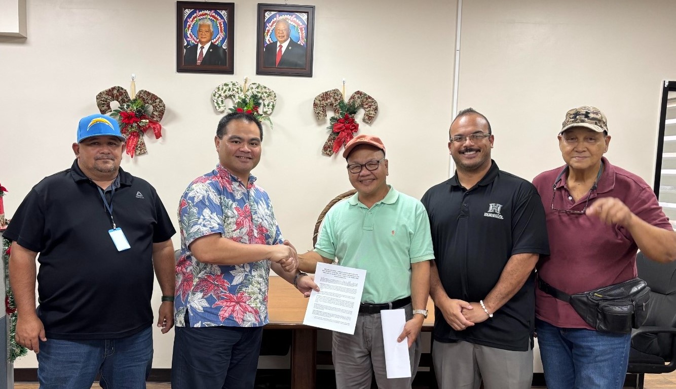 From left, Parks and Recreation Division Director Mike Cruz, Department of Lands and Natural Resources Secretary Sylvan O. Igisomar, Kagman Agricultural Farms and Producers Association Inc. President Glenn Manglona, DLNR Special Advisor Cameron S. Nicholas and KAFPA Treasurer Jesus M. Castro pose for photo after signing a memorandum of understanding at the DLNR office on Friday.Contributed photo