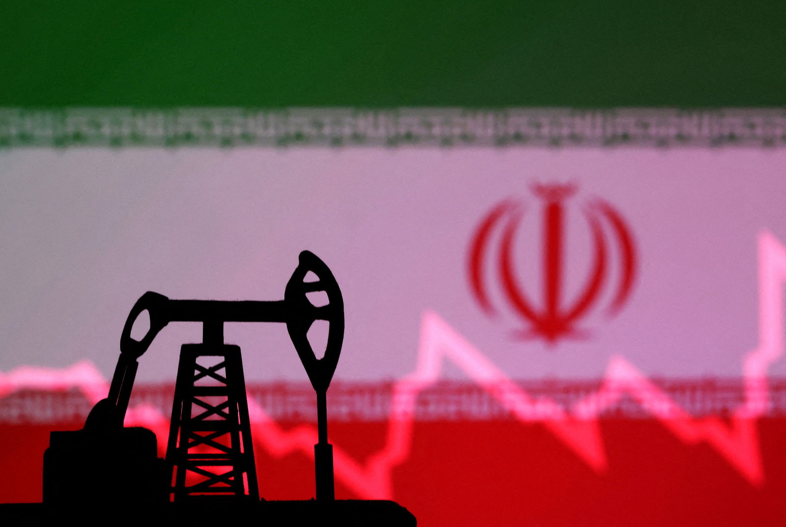 Iranian flag with stock graph and an oil pump jack miniature model are seen in this illustration taken Oct. 9, 2023.