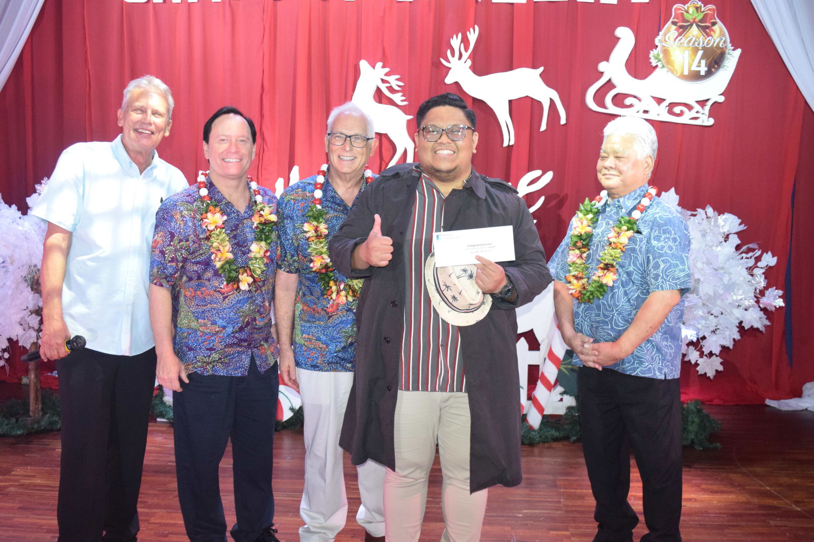 Founder’s Award recipient Matthew Vallo, second right, holds his prize as he poses for a photo with Gov. Arnold I. Palacios, right, Bridge Capital co-owners Shawn Scott, second left, and John Baldwin, center, and host Brad Cleven.