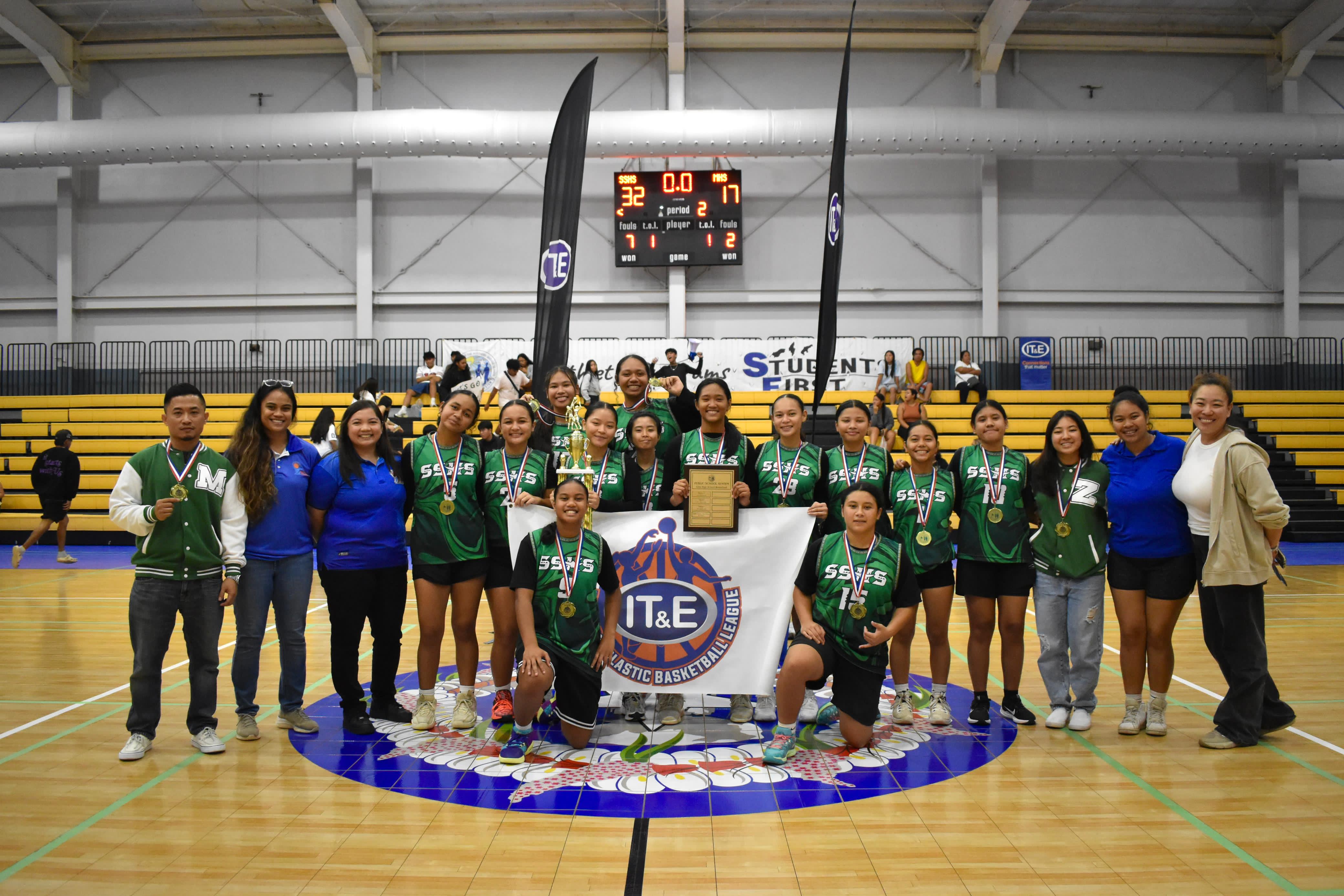 Two-time champion Saipan Southern High School players pose with the trophy in the girls highs school division of the PSS-NMIBF Interscholastic Basketball League SY24-25 at the Ada gym on Friday. 