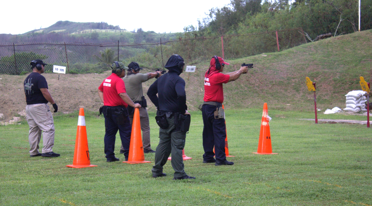 Chief Marshal Jason Tarkong and Probation Officer Timothy Cruz aim for their targets during the Semi-Finals Round of the 2nd Annual NMI Judiciary Firearms Competition.