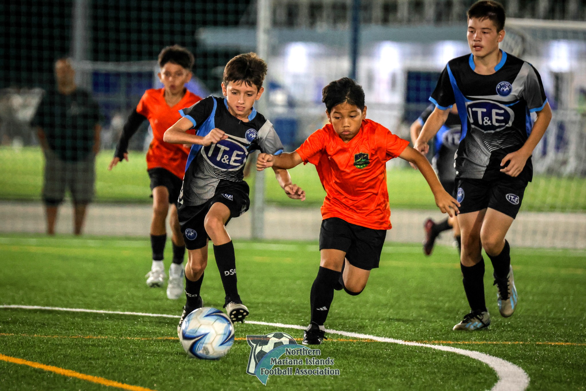 MP United's Beau Bauer races against a Kanoa player for the possession during the U12 boys division title match of the TakeCare Youth Soccer League Fall 2024 at the NMI Soccer Training Center in Koblerville on Saturday.