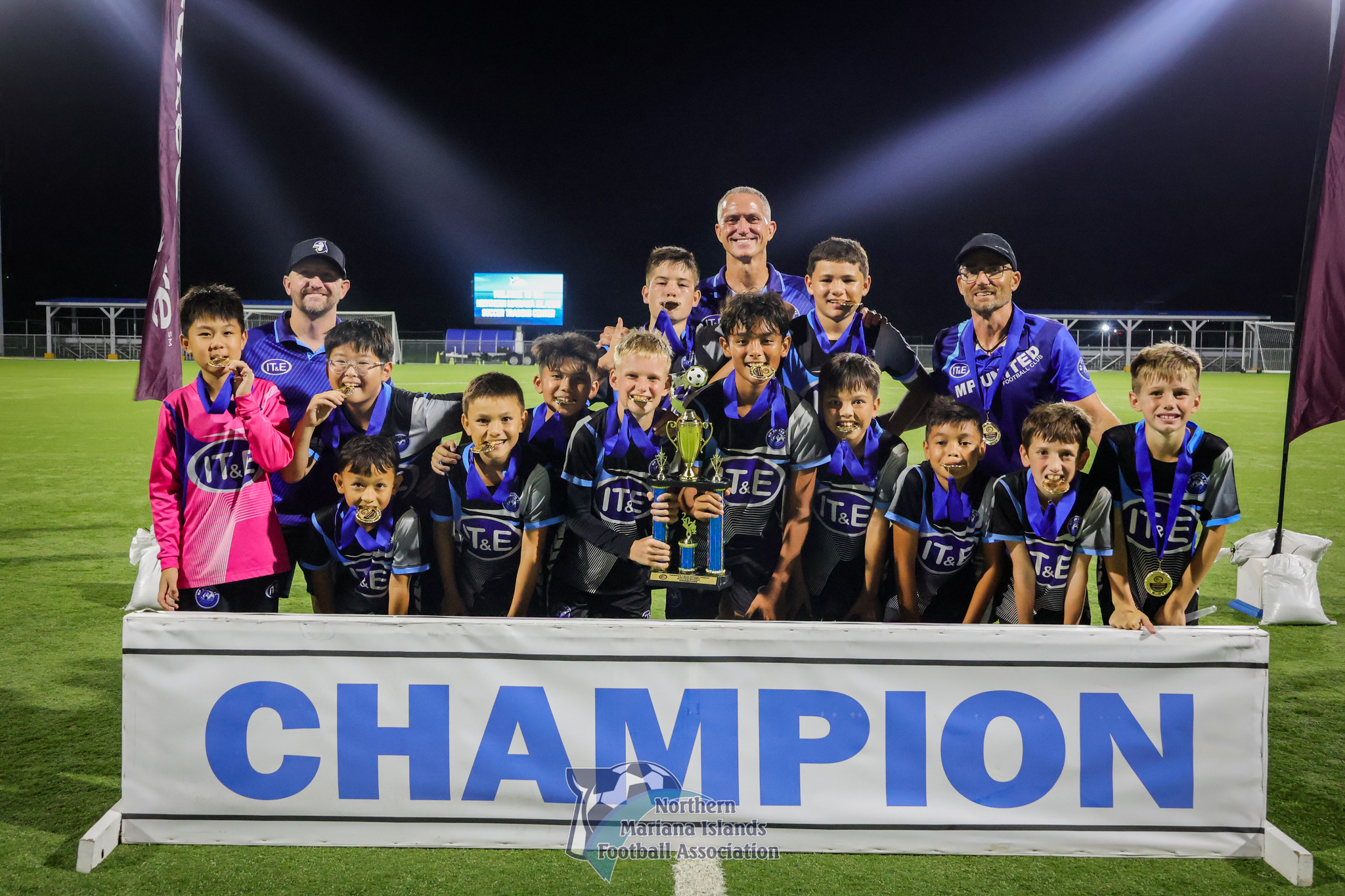MP United Football Club players pose with the U12 boys division trophy after defeating Kanoa Football Club, 1-0, in the title match of the TakeCare Youth Soccer League Fall 2024 at the NMI Soccer Training Center in Koblerville on Saturday.