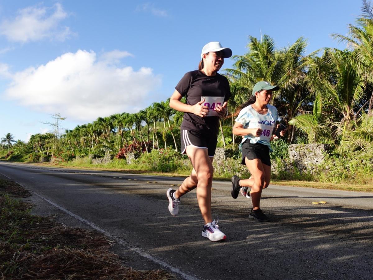 Marquit Chavez and Jane Malabanan of Saipan pass along a quiet and picturesque road during Rota Marathon 2024. Registration is open at www.mymarianas.com for the 2nd Annual Rota Marathon on Jan. 18, 2025.