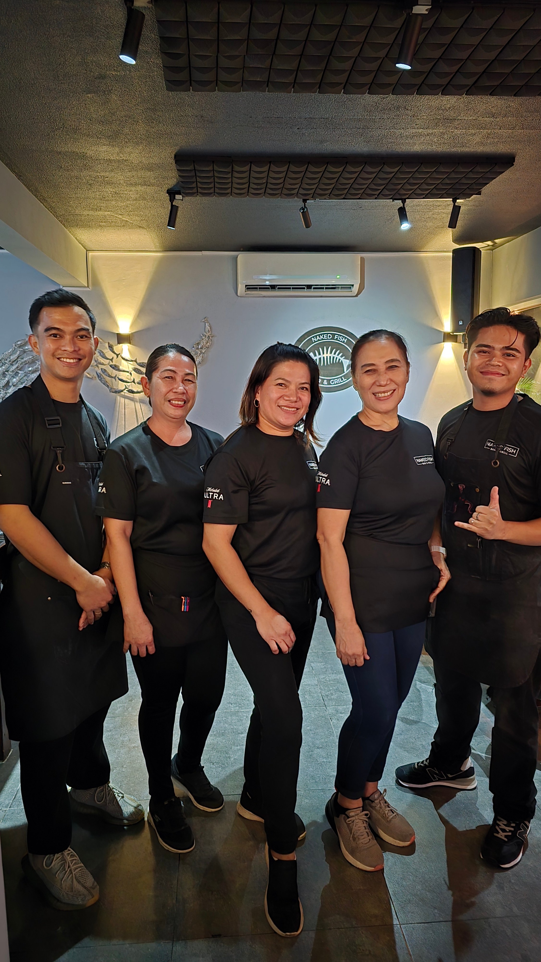 Naked Fish Bar & Grill staff.