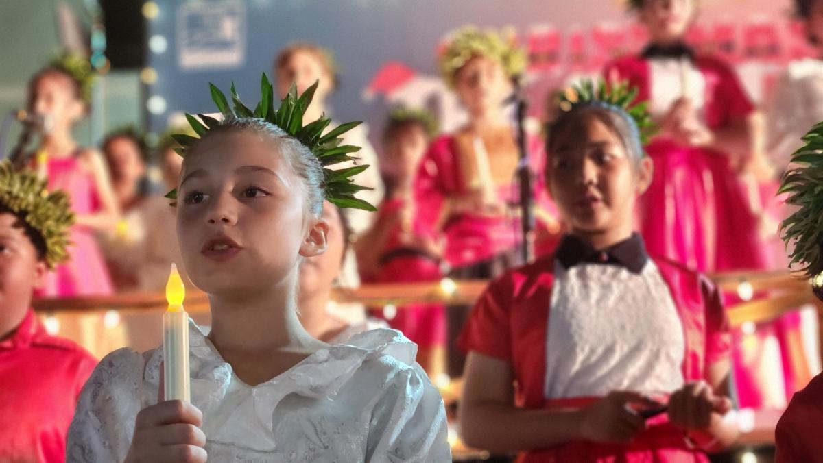 Students sing Christmas carols at the 20th Annual Christmas in The Marianas on Dec. 7, 2024, in Garapan, Saipan. The annual signature event of the Marianas Visitors Authority featuring school children performances will return on the evening of Dec. 14.