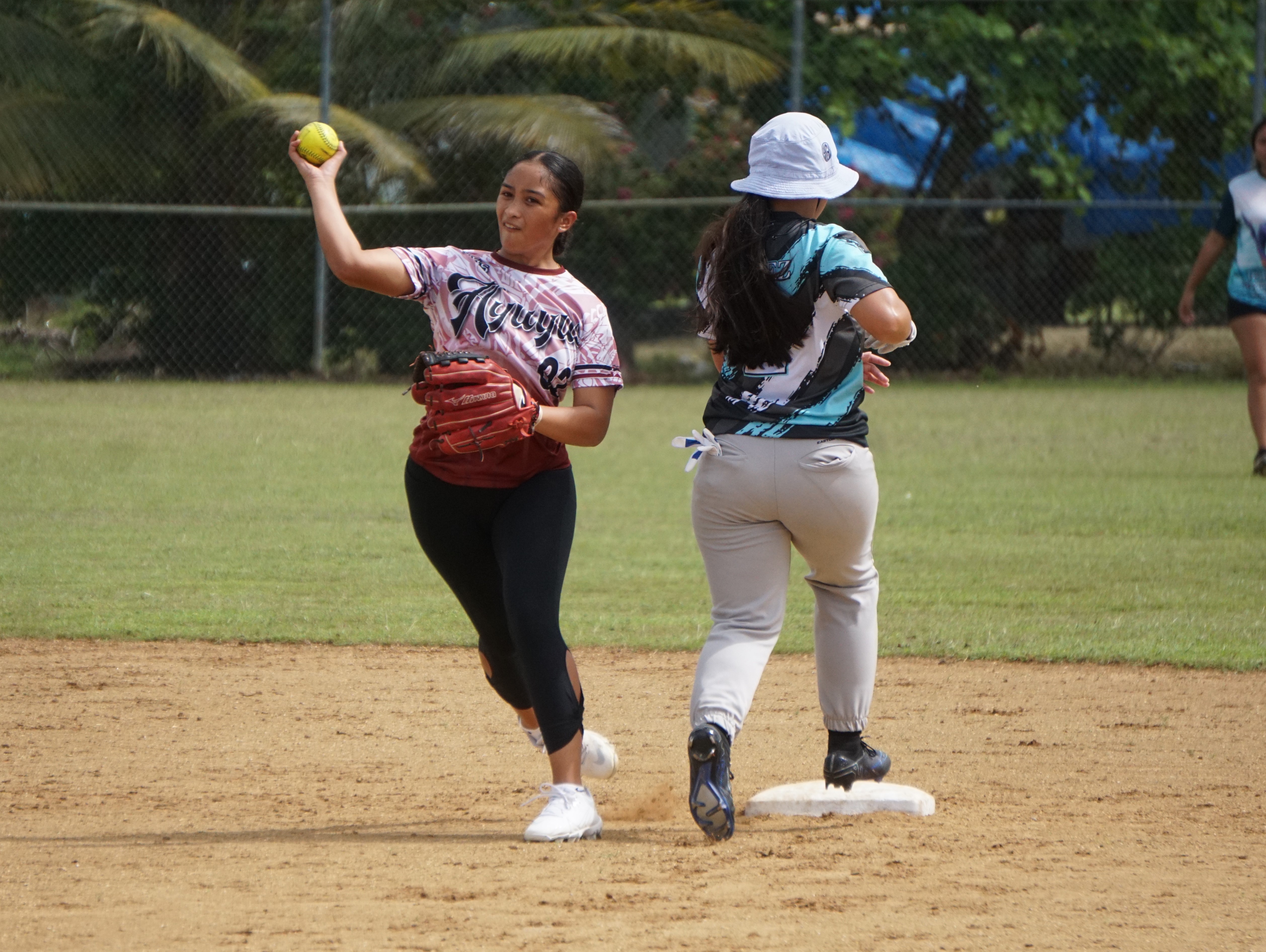 Wettz second baseman Jada Norita throws to first in an attempted double play during a game against the Dirty Diamonds in the NMI Softball Association Women’s League at the Miguel "Tan Ge" Pangelinan Softball Field on Saturday. 