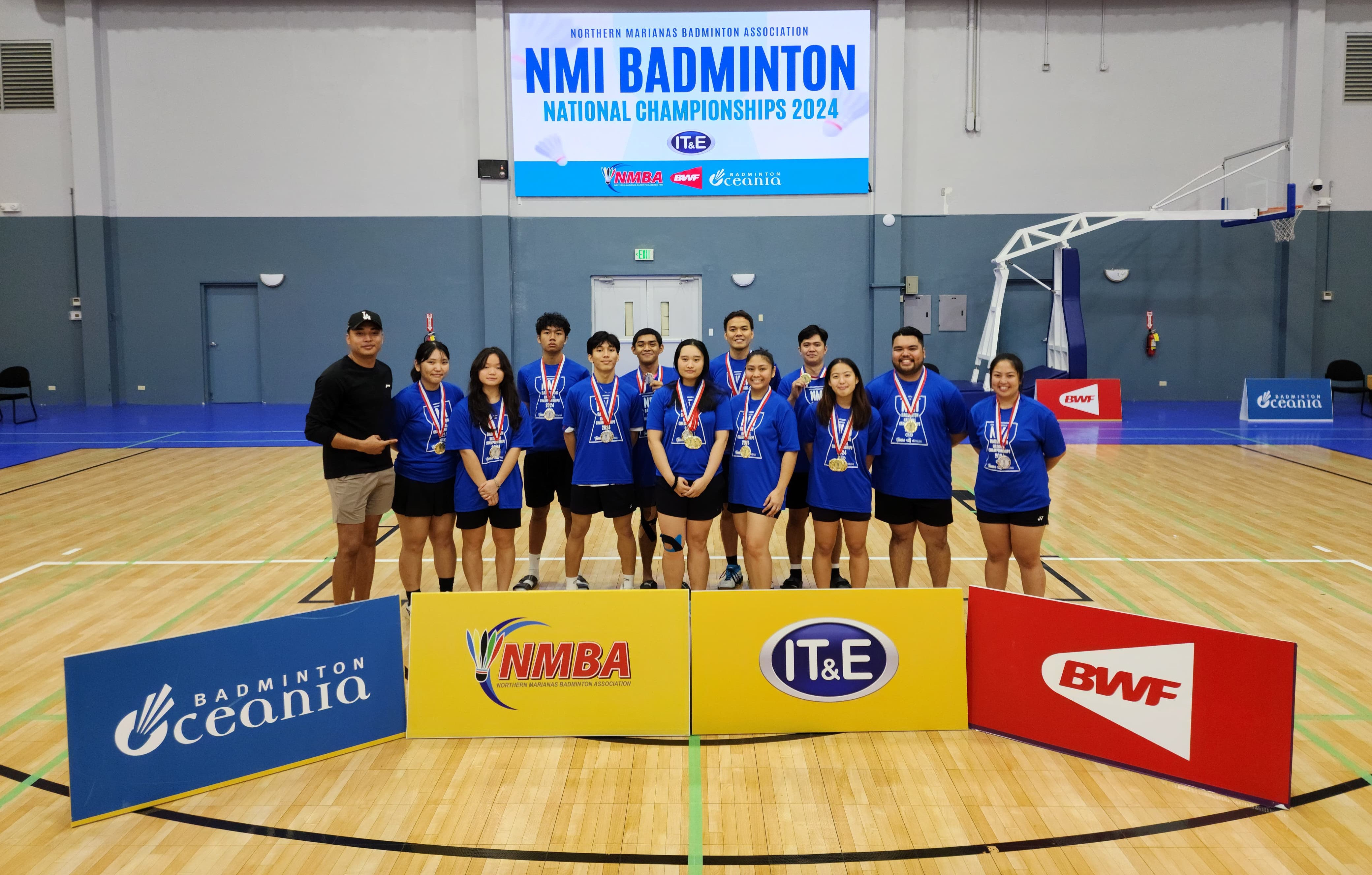 The top three event winners in the open division pose for a group photo during the awards ceremony of the NMI Badminton National Championships 2024 at the Ada gym on Saturday. 