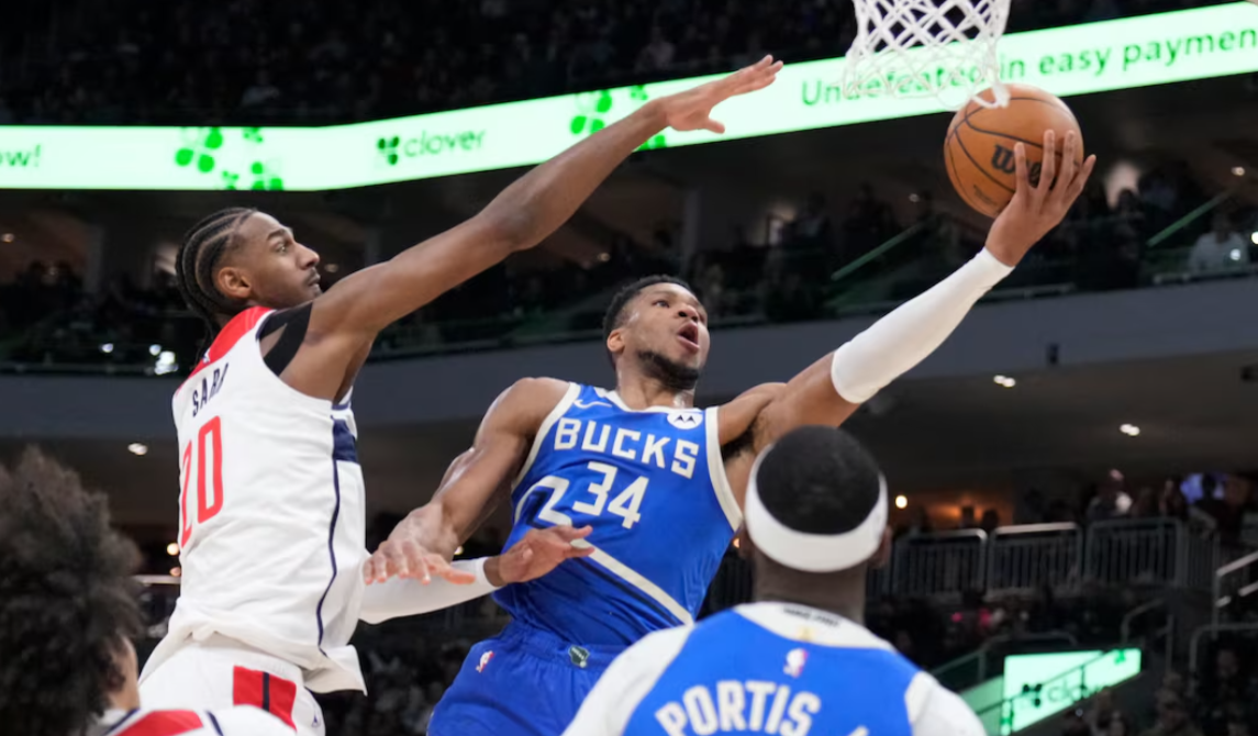 Milwaukee Bucks forward Giannis Antetokounmpo (34) drives to the basket against Washington Wizards forward Alexandre Sarr (20) in the first half at Fiserv Forum in Milwaukee, Wisconsin, Nov. 30, 2024.