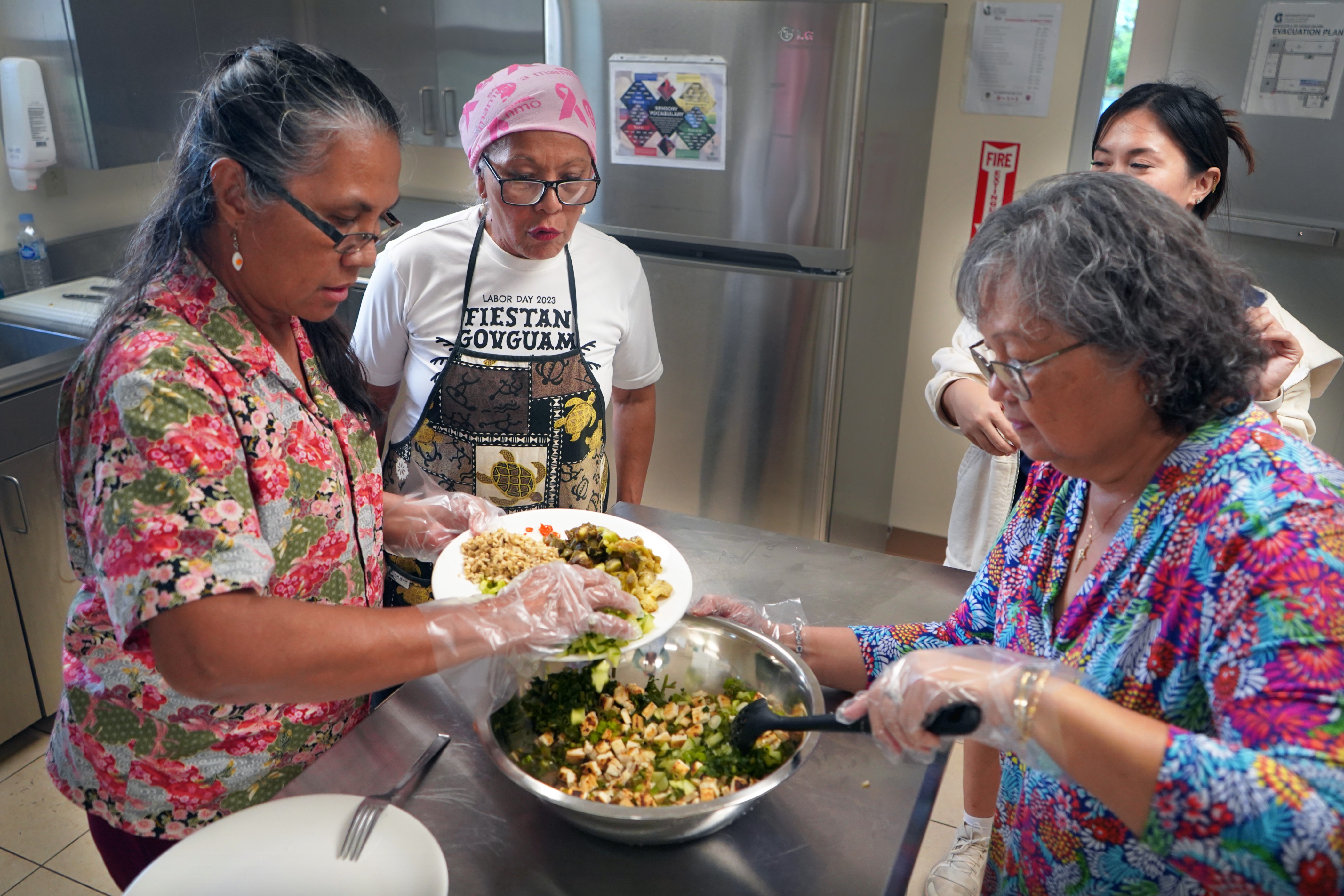 Workshop participants work together to prepare tofu kelaguen during the combined Nihi ta Fanmama’tinas (Let’s Cook) and Keys to Embracing Healthy Aging workshop offered in June by the University of Guam extension nutrition team. The six-session workshop series will be offered for a second time starting on Dec. 2.